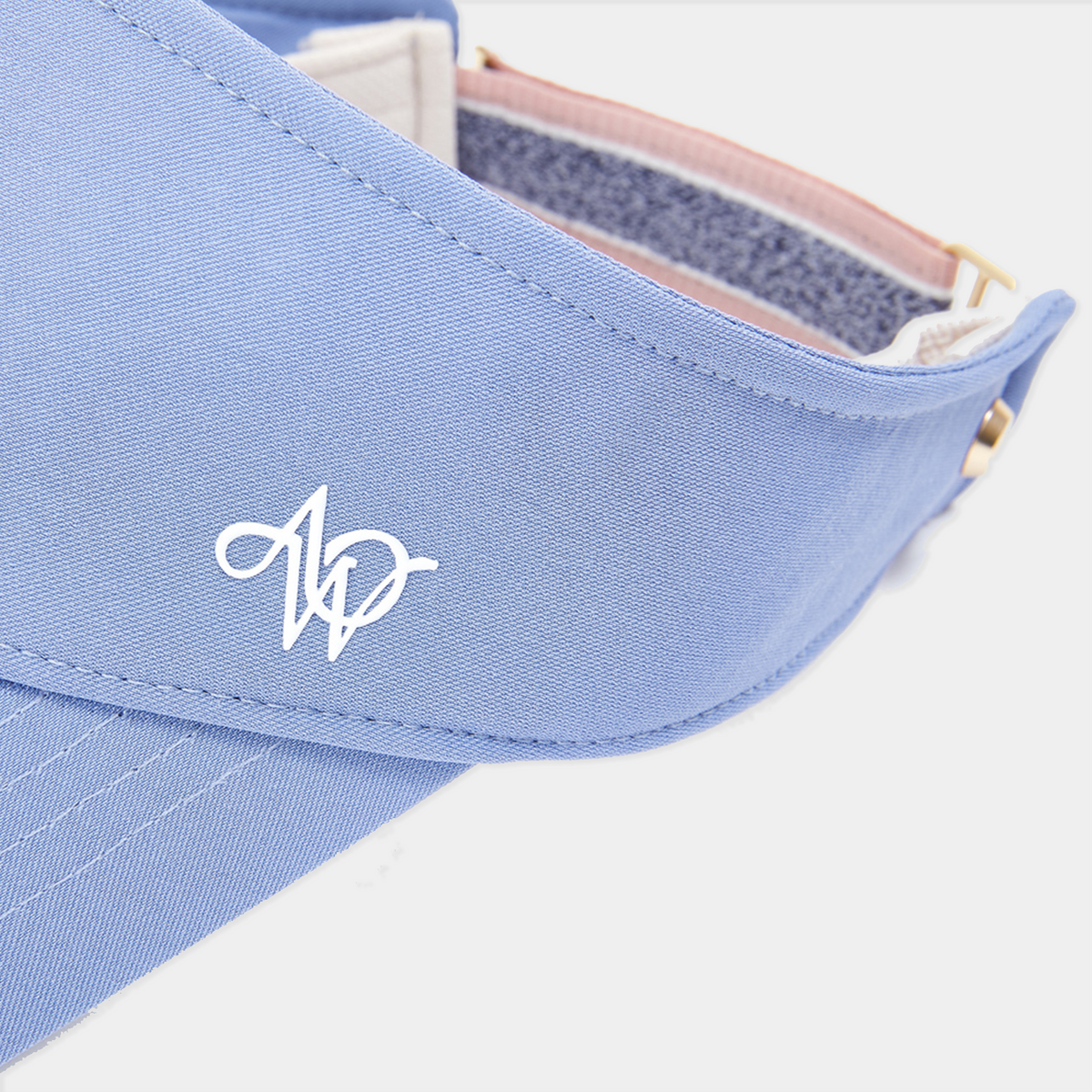 Light blue visor with a logo on a white background