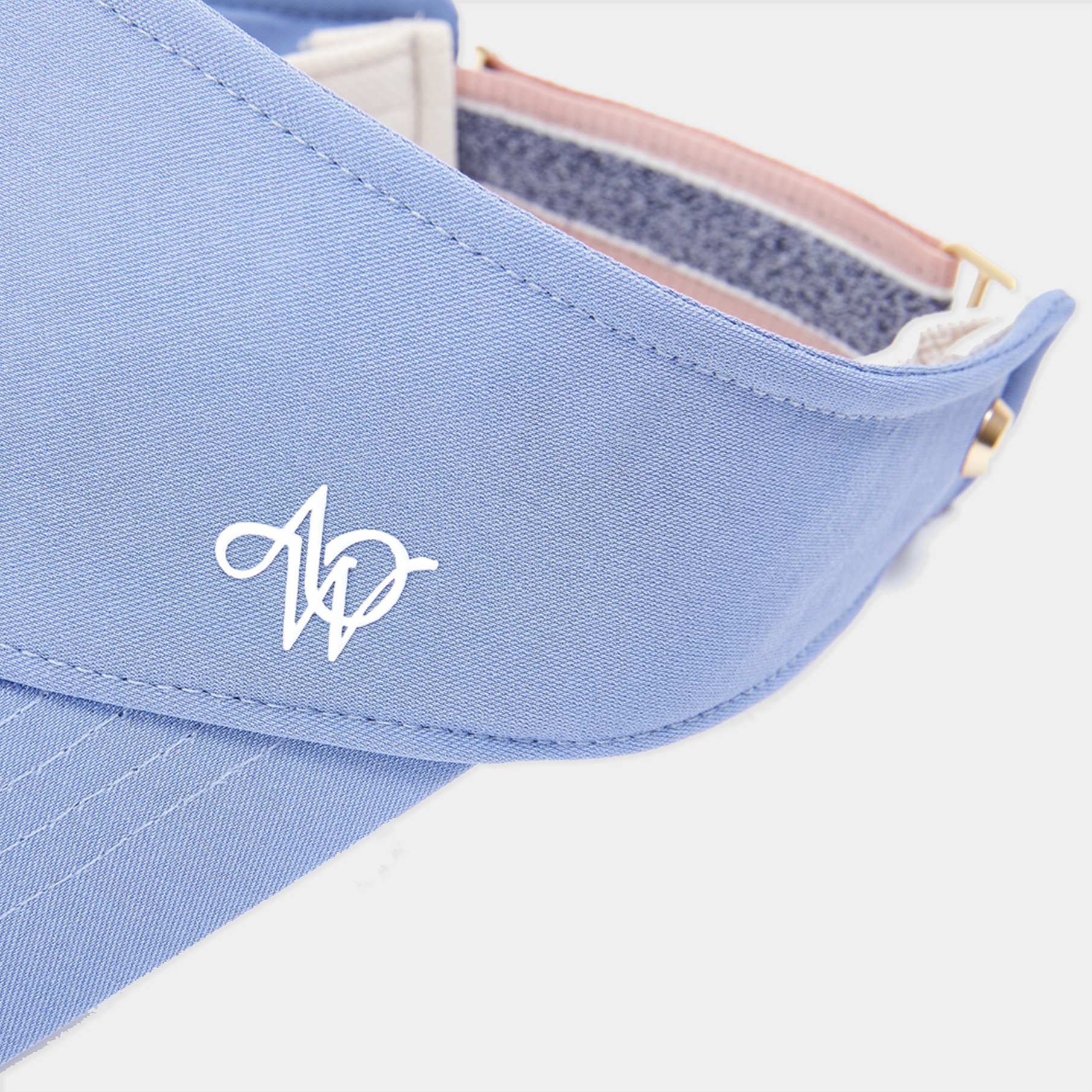Light blue visor with a logo on a white background