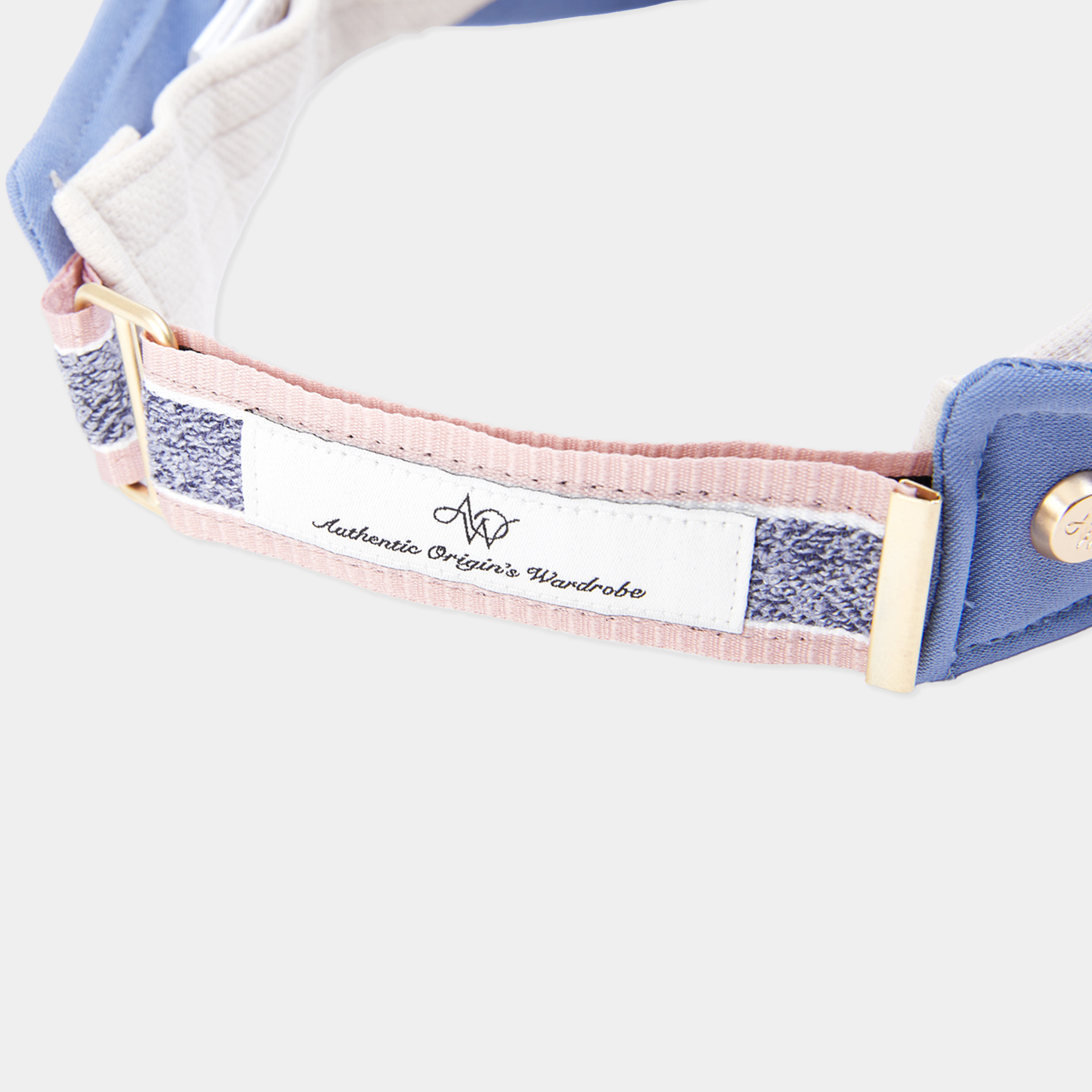 Close-up of a visor with a brand label on a white background