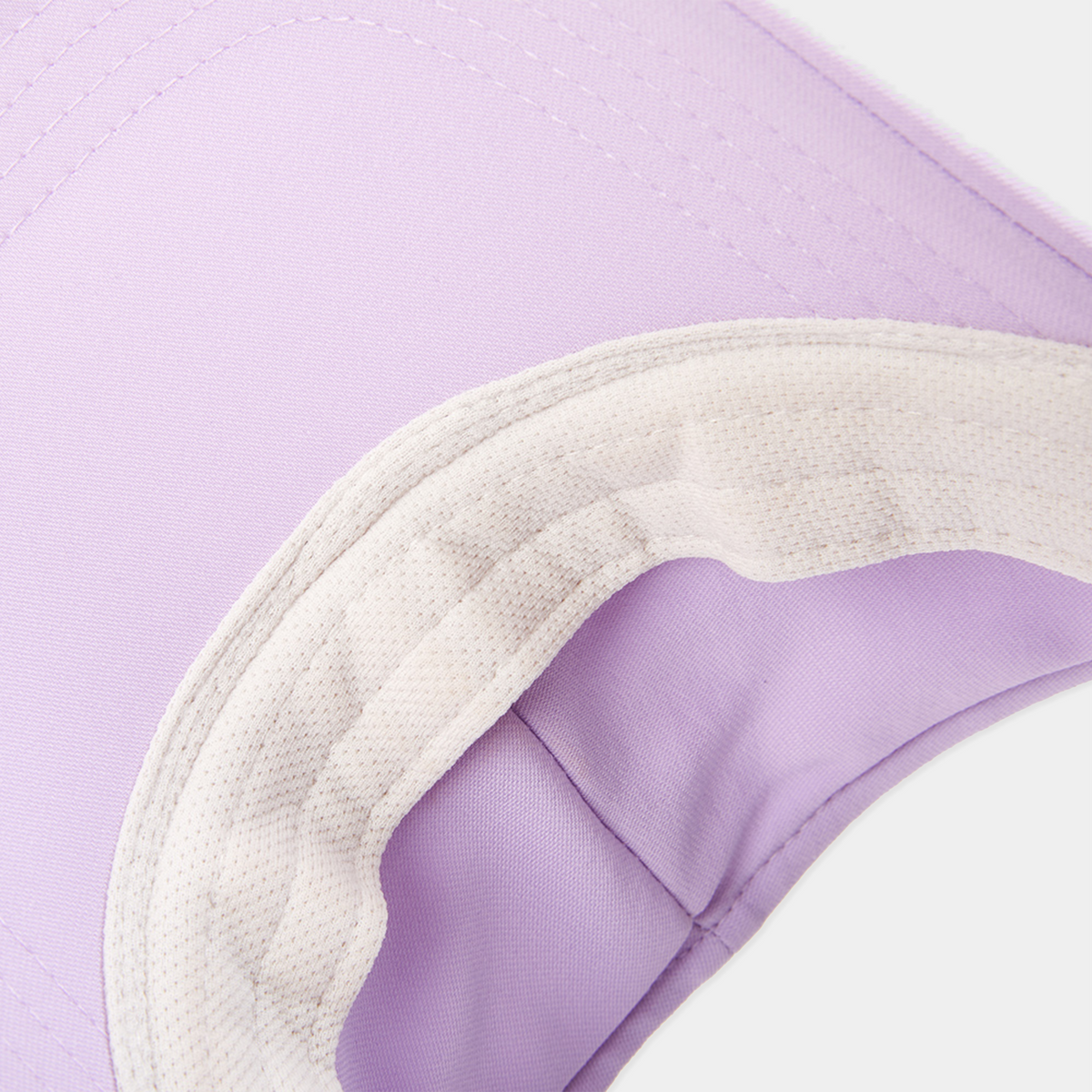 Close-up of a visor with a purple corner on a light purple background