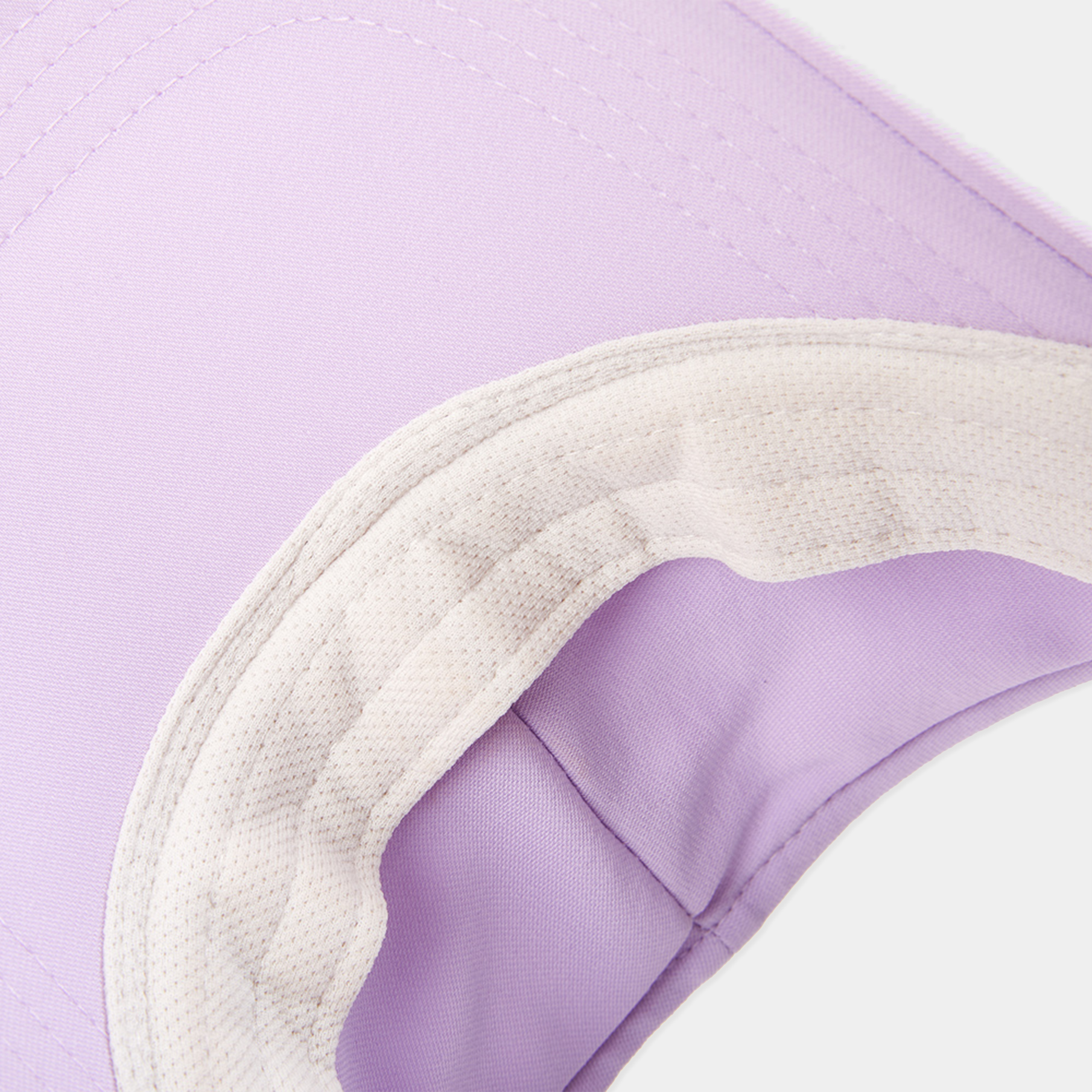 Close-up of a visor with a purple corner on a light purple background