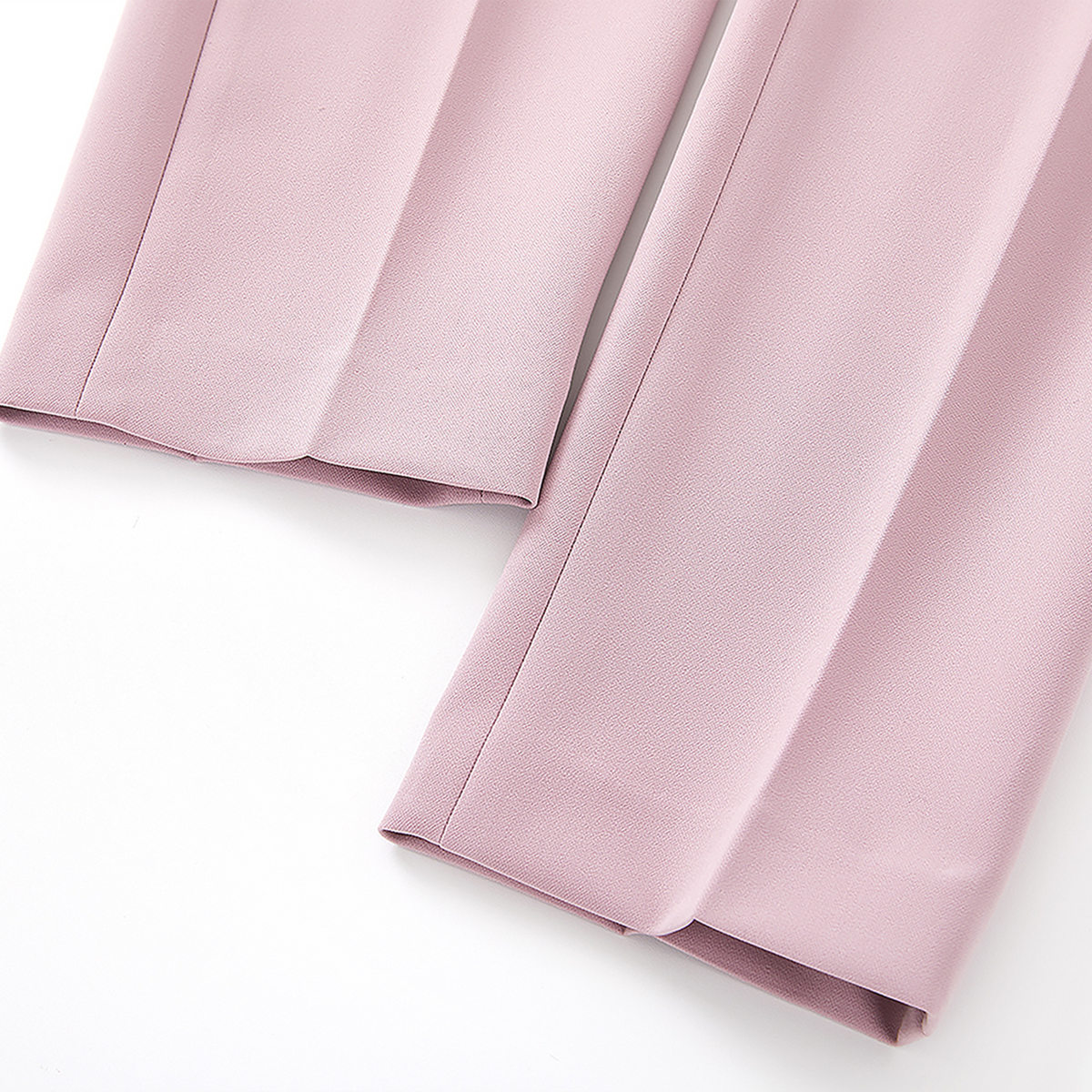 Close-up of pink fabric on a white background