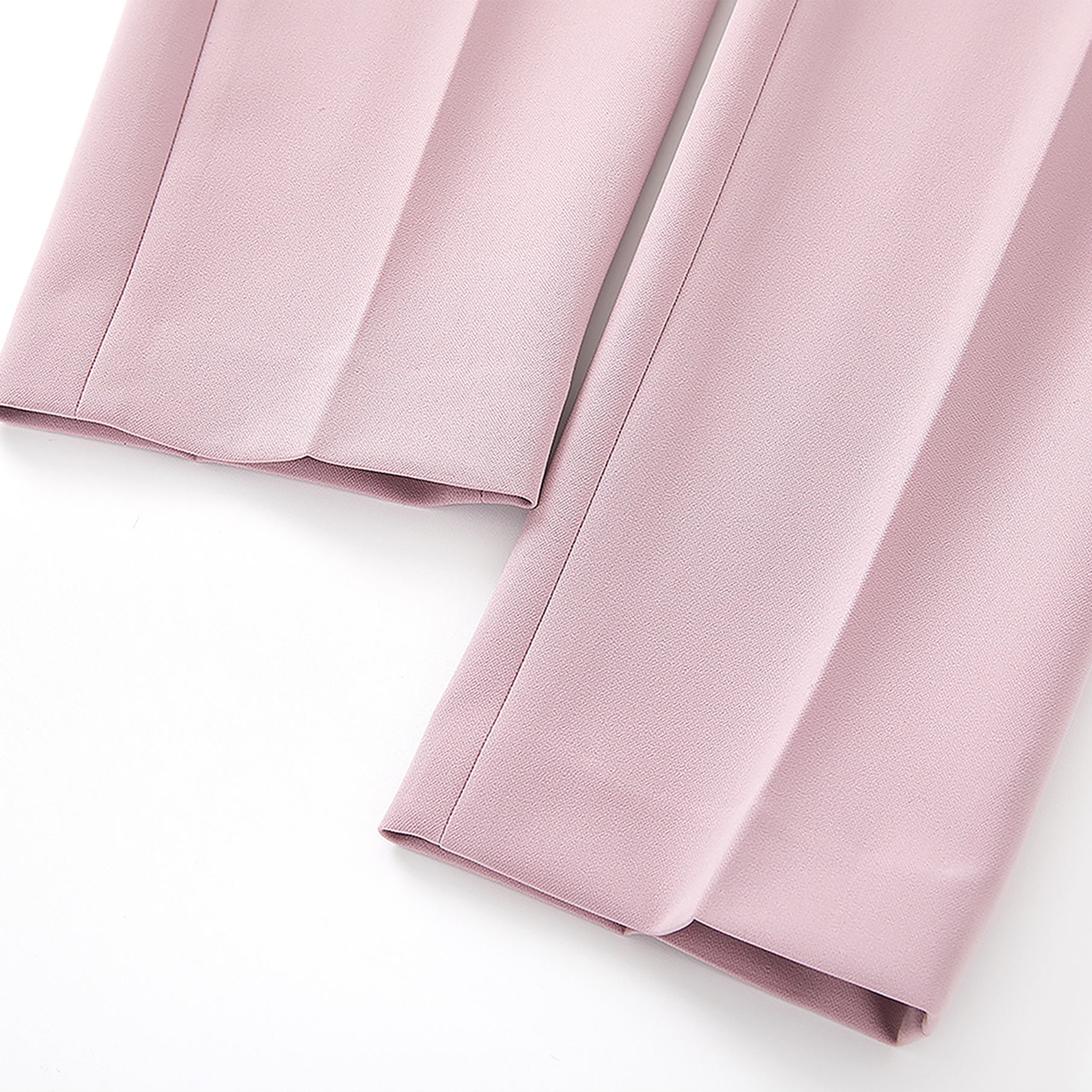 Close-up of pink fabric on a white background