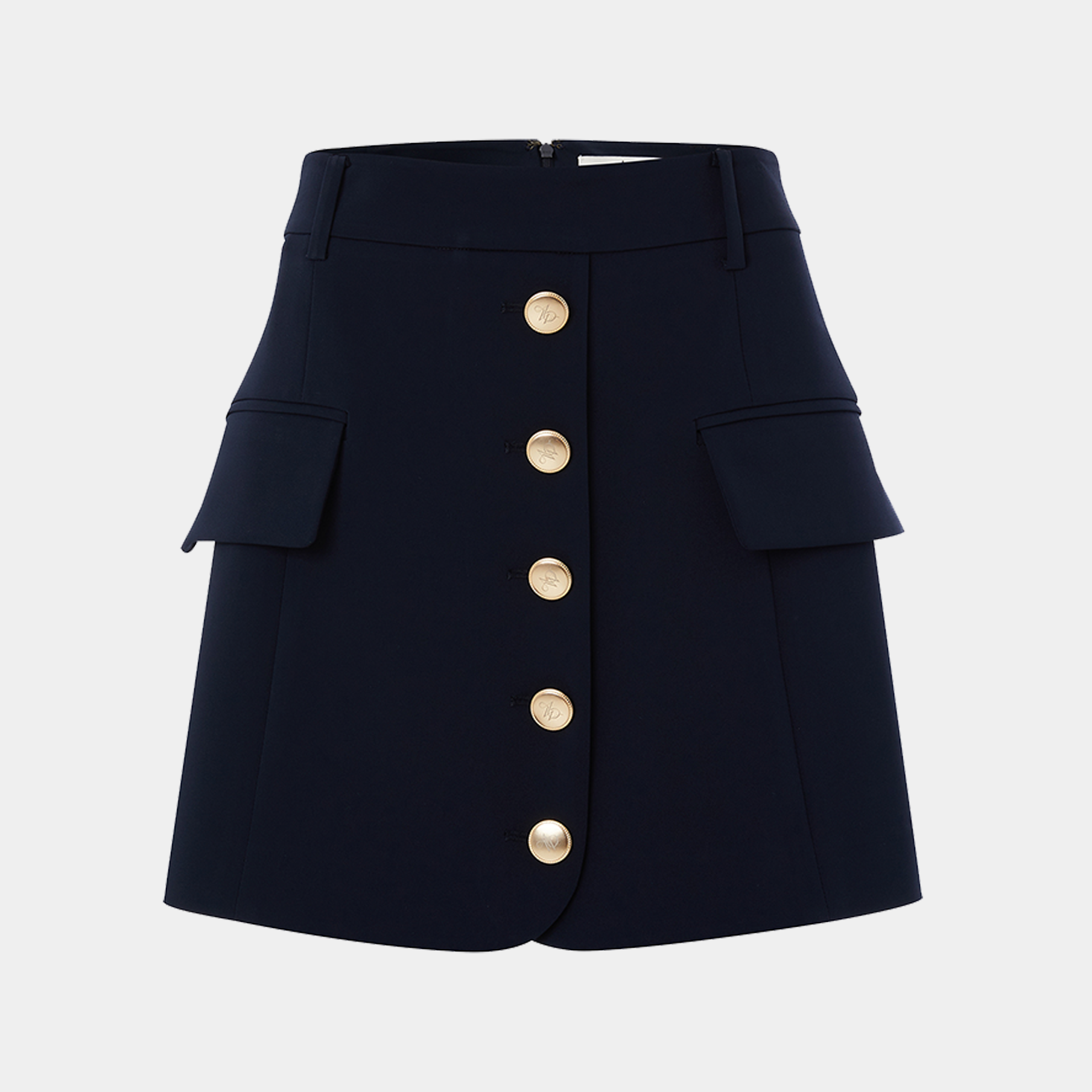 Navy blue skirt with gold buttons on a light gray background