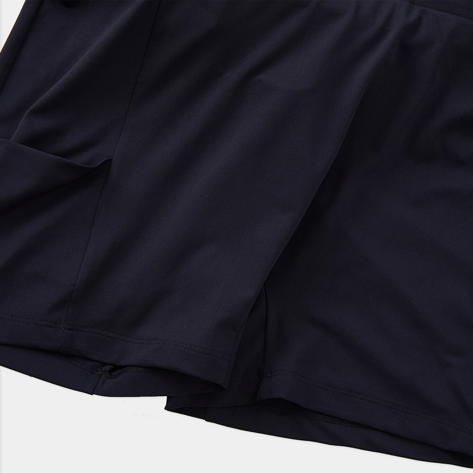 Close-up of a dark blue fabric texture on a white background