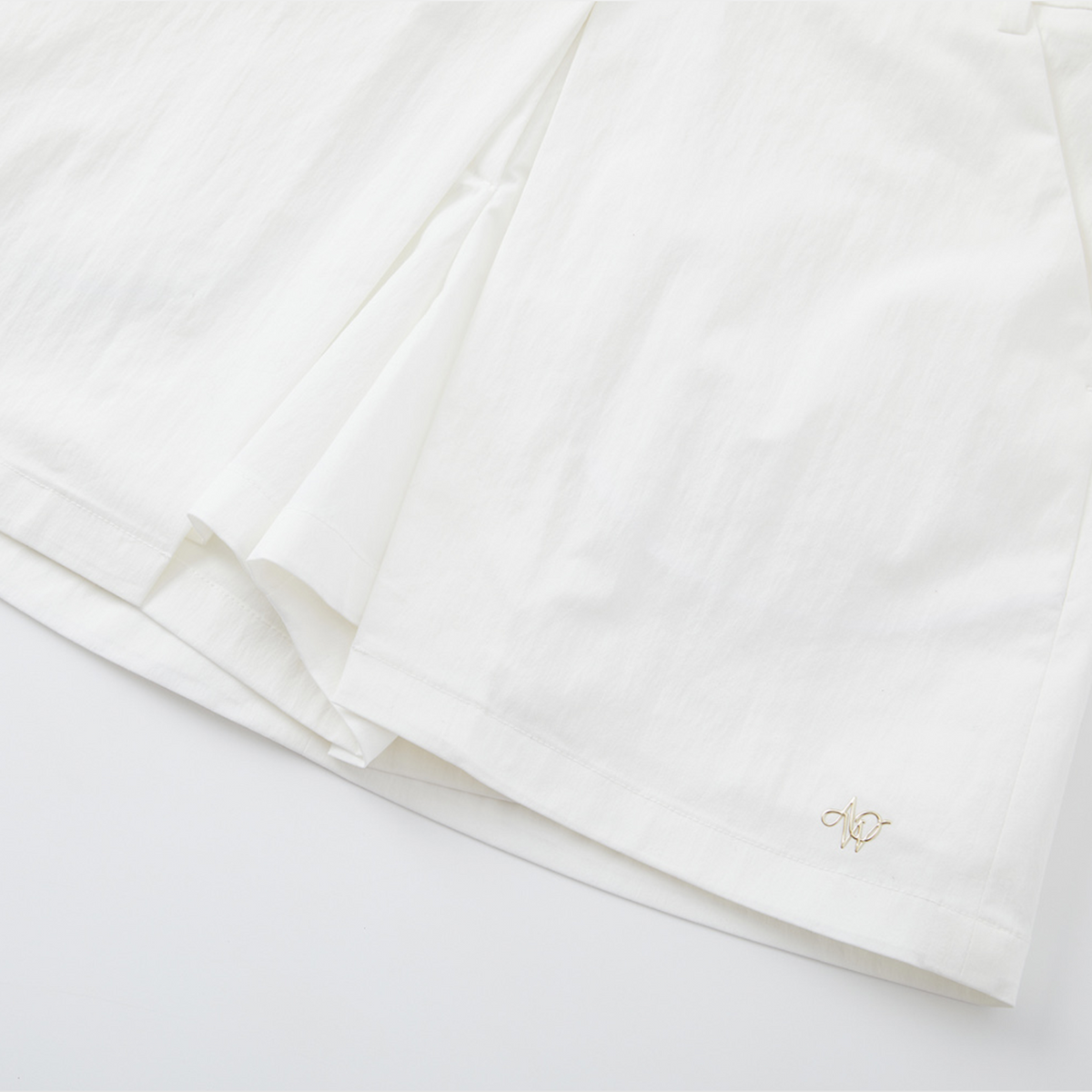 White fabric with a small logo on a white background