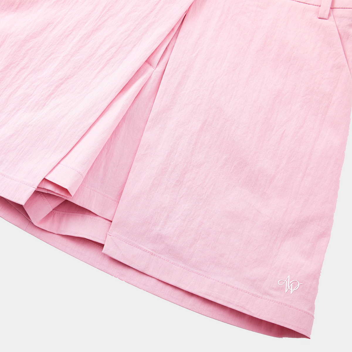Close-up of pink fabric with a soft texture on a light gray background