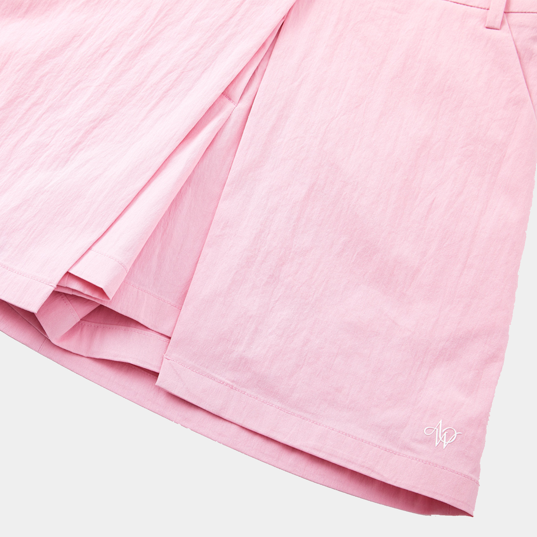 Close-up of pink fabric with a soft texture on a light gray background