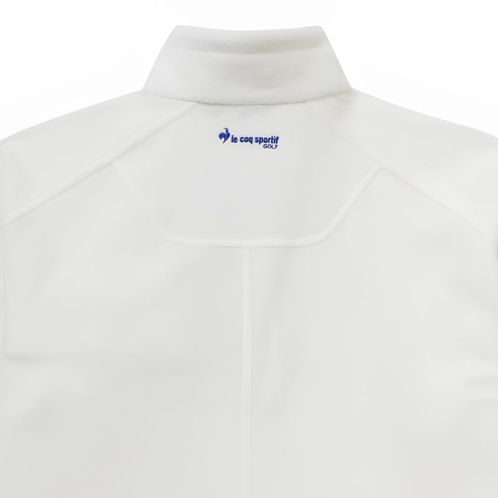 Close-up of the back of a white athletic quarter-zip pullover jacket, showing a mock neck collar with a blue 'le coq sportif' logo printed inside.
