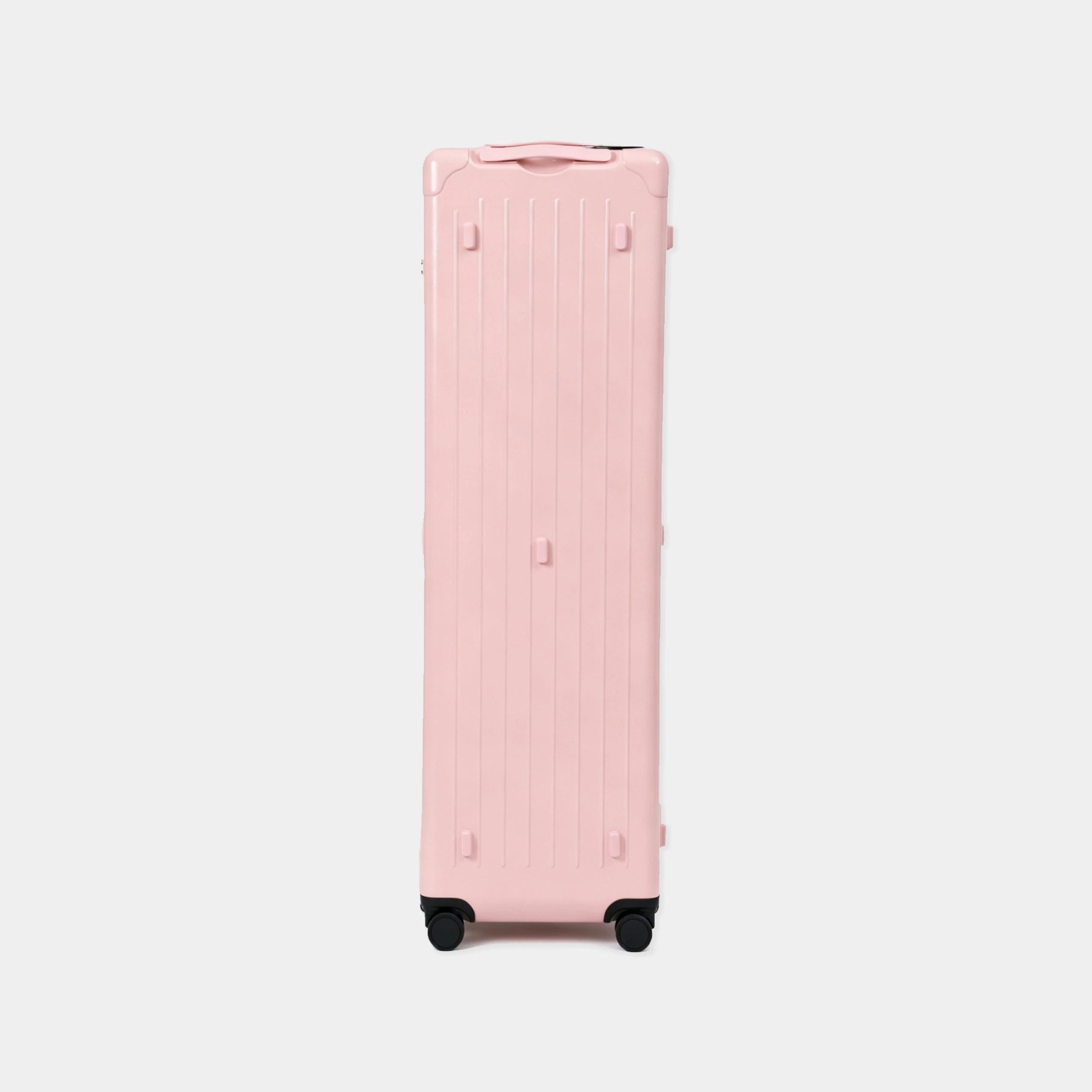Pink suitcase on a light gray background