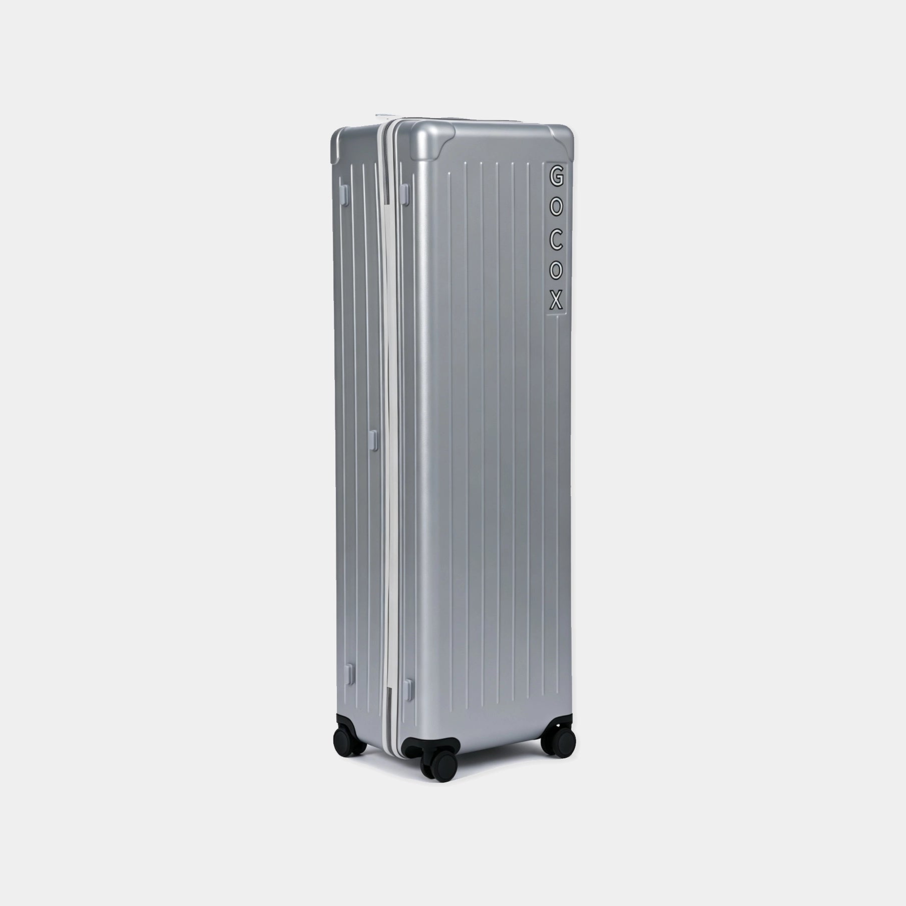 Silver travel case with brand logo on a light gray background