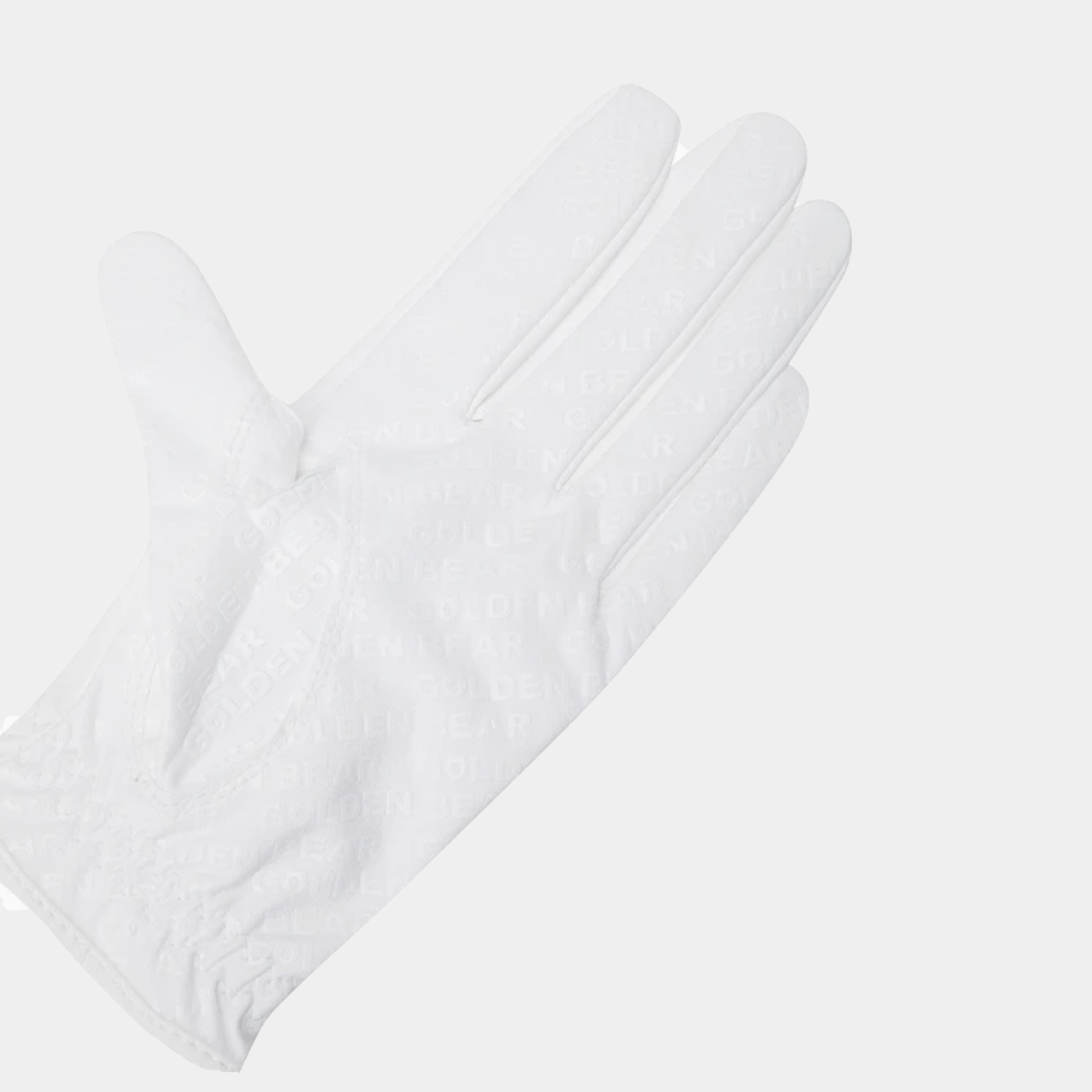 White golf glove with perforated fingers and GB bear logo patch on wrist closure on a light gray background