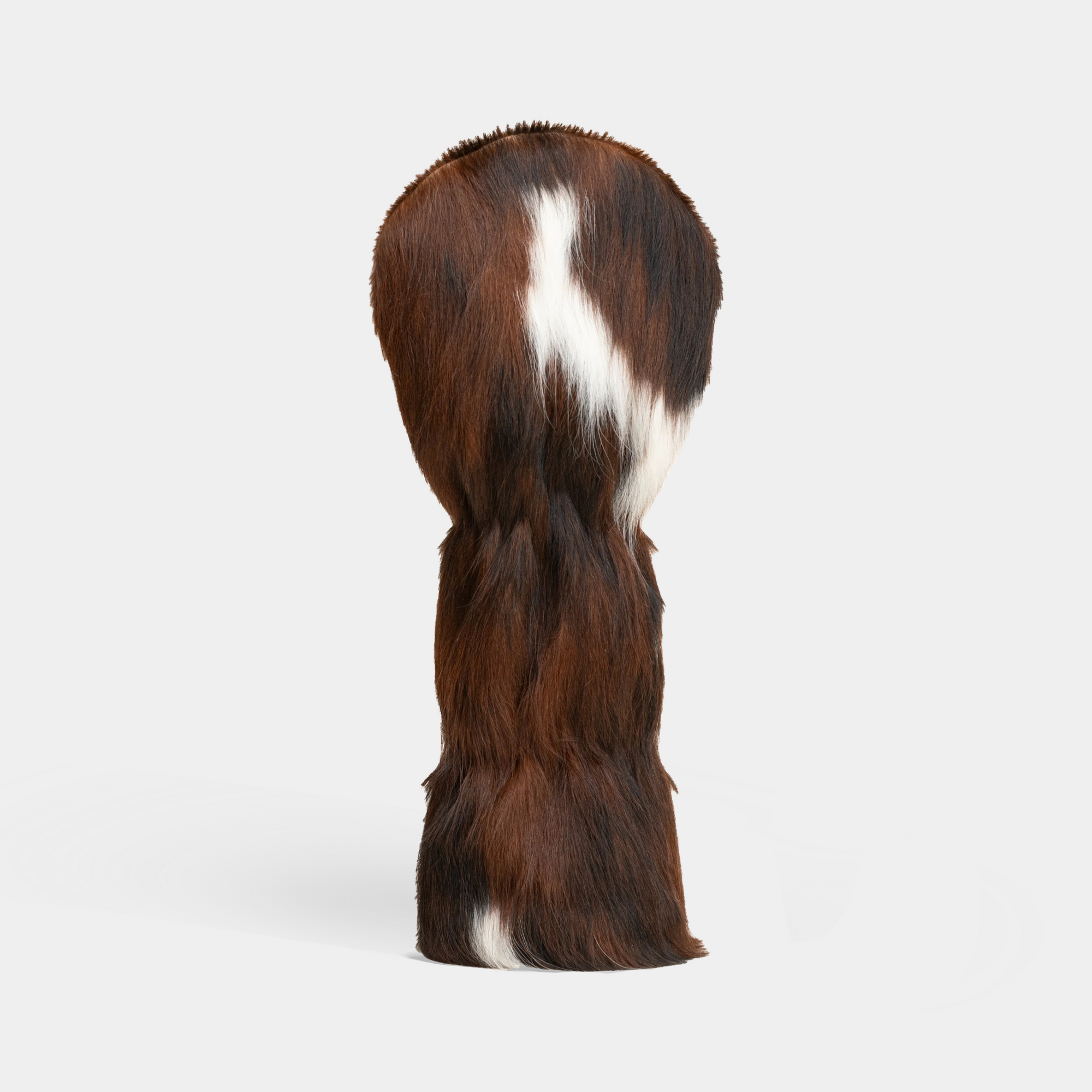 Polk Cowhide Head Cover with brown and white color on a light gray background