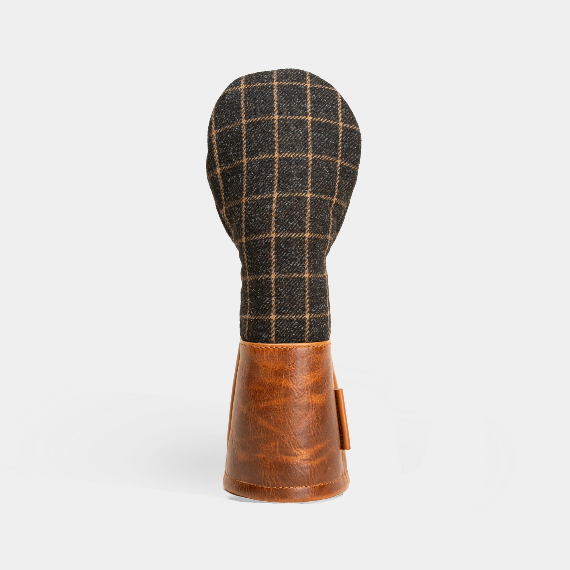 Fairway wood head cover with plaid pattern and brown leather accents on a white background