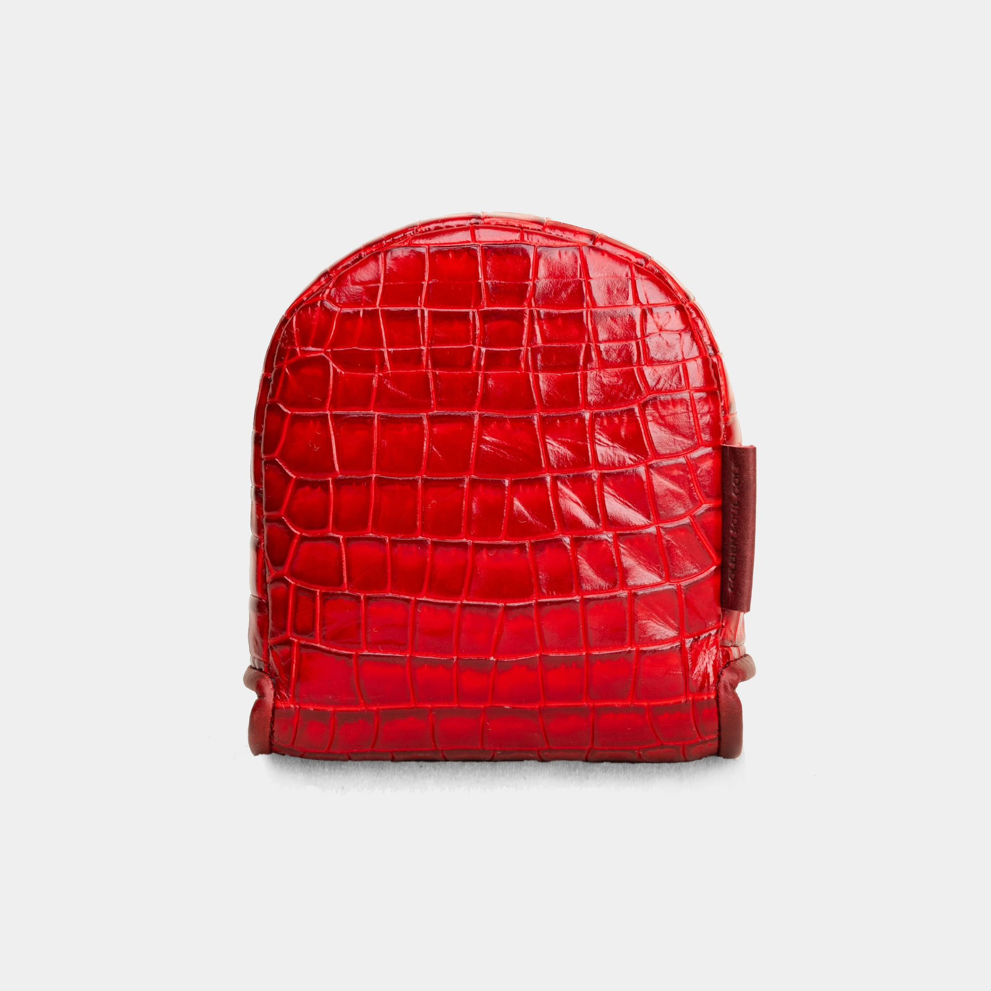 Red crocodile-patterned d3 putter cover on a light gray background - back view