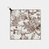 A square fabric towel with a brown botanical and animal toile pattern on a light beige background, featuring a black carabiner clip at the top left, shown against a light gray background.