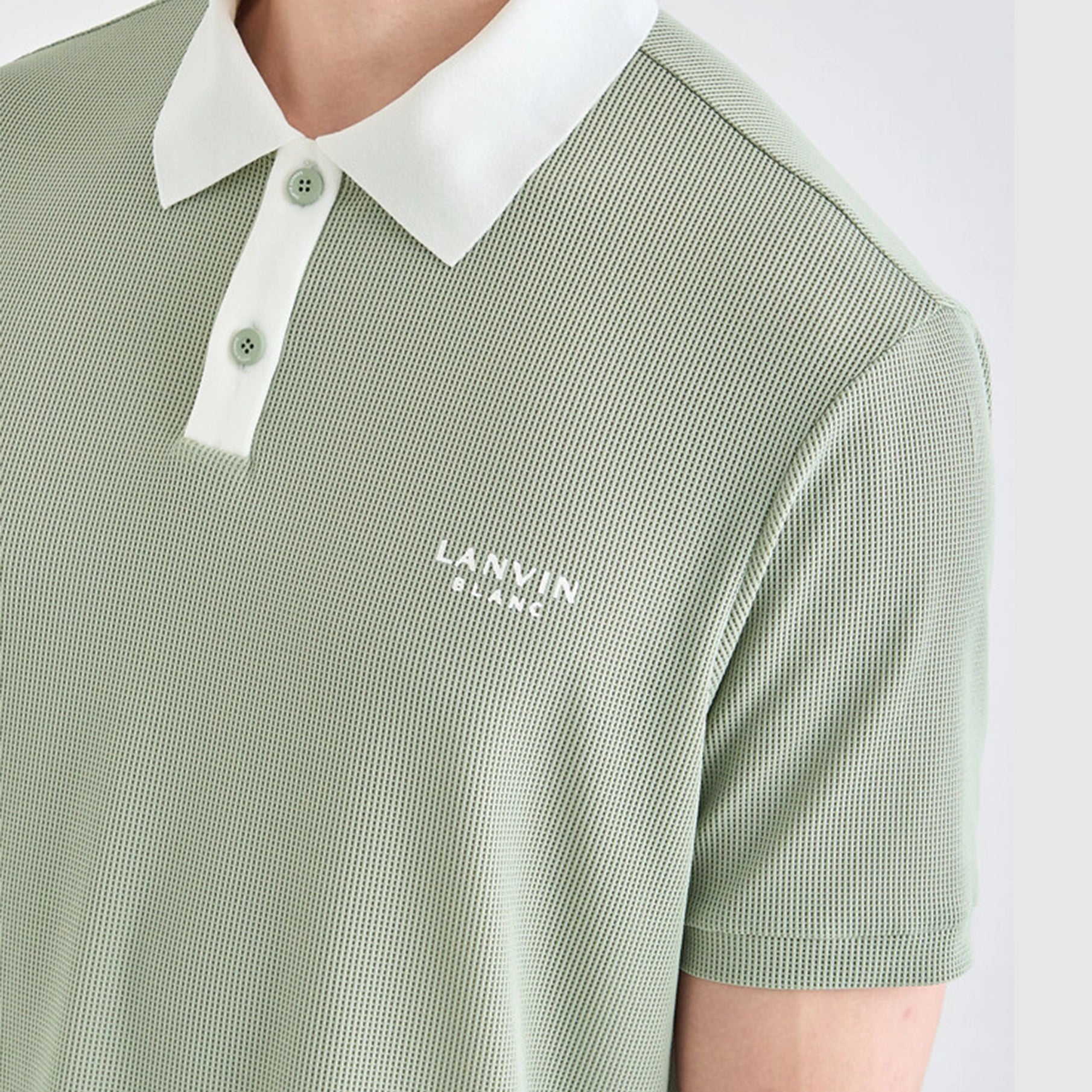Green checkered polo shirt with white collar and 'LANVIN' logo on a light gray background