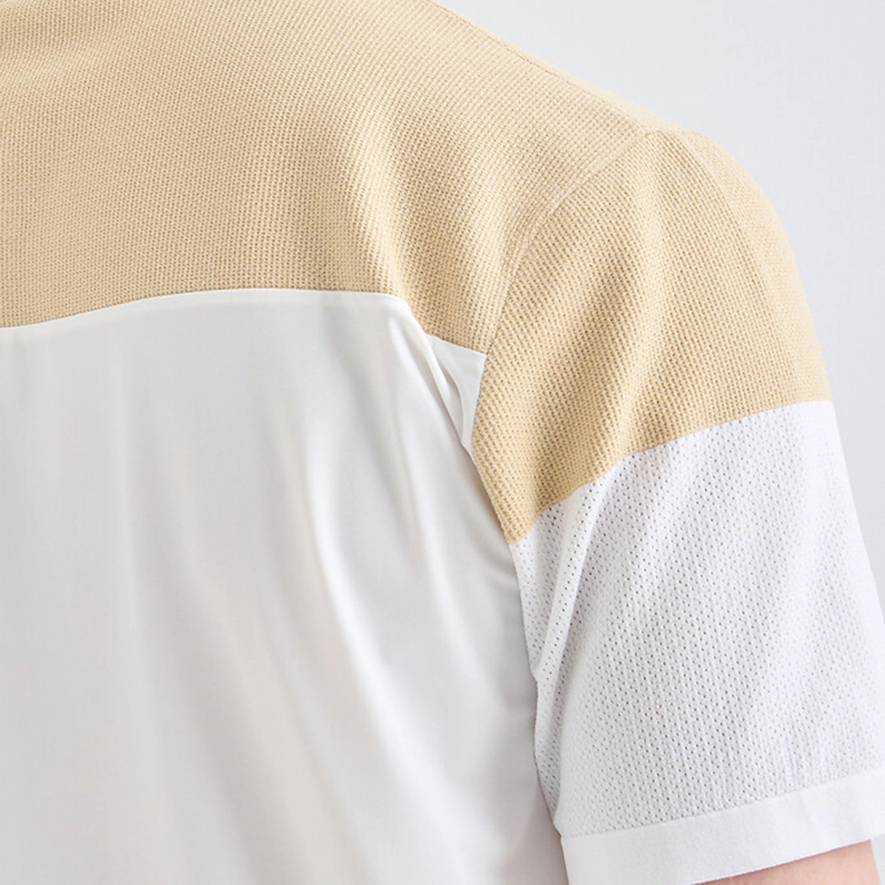 Close-up of a beige and white shirt with textured fabric