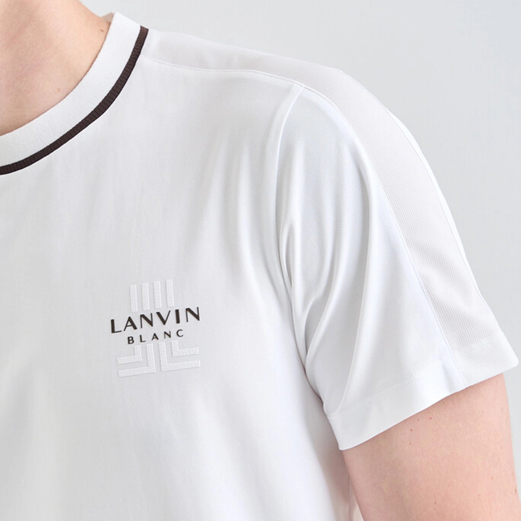 White t-shirt with 'LANVIN BLANC' logo on a plain background