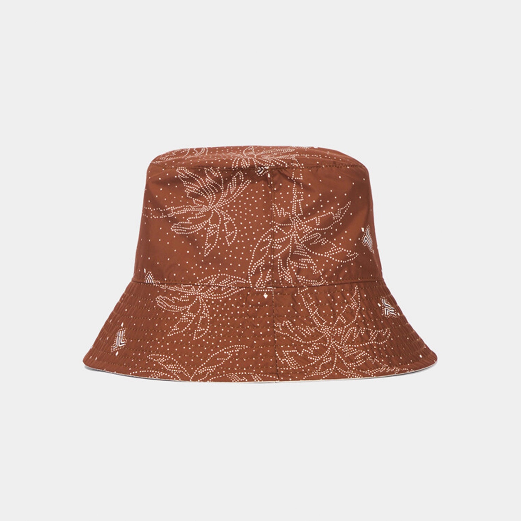 Brown bucket hat with leaf pattern on a white background