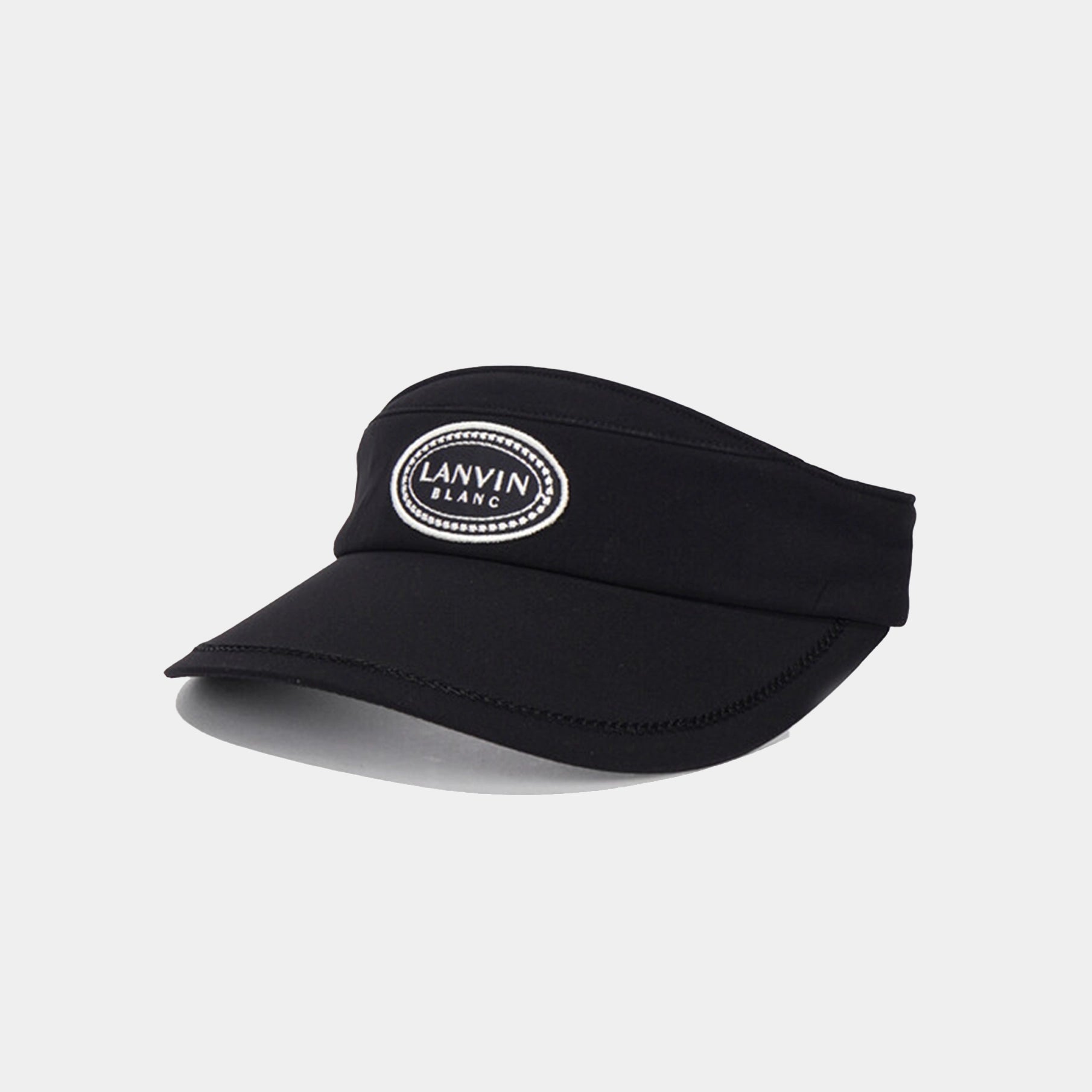 Black visor with a brand logo on a light gray background