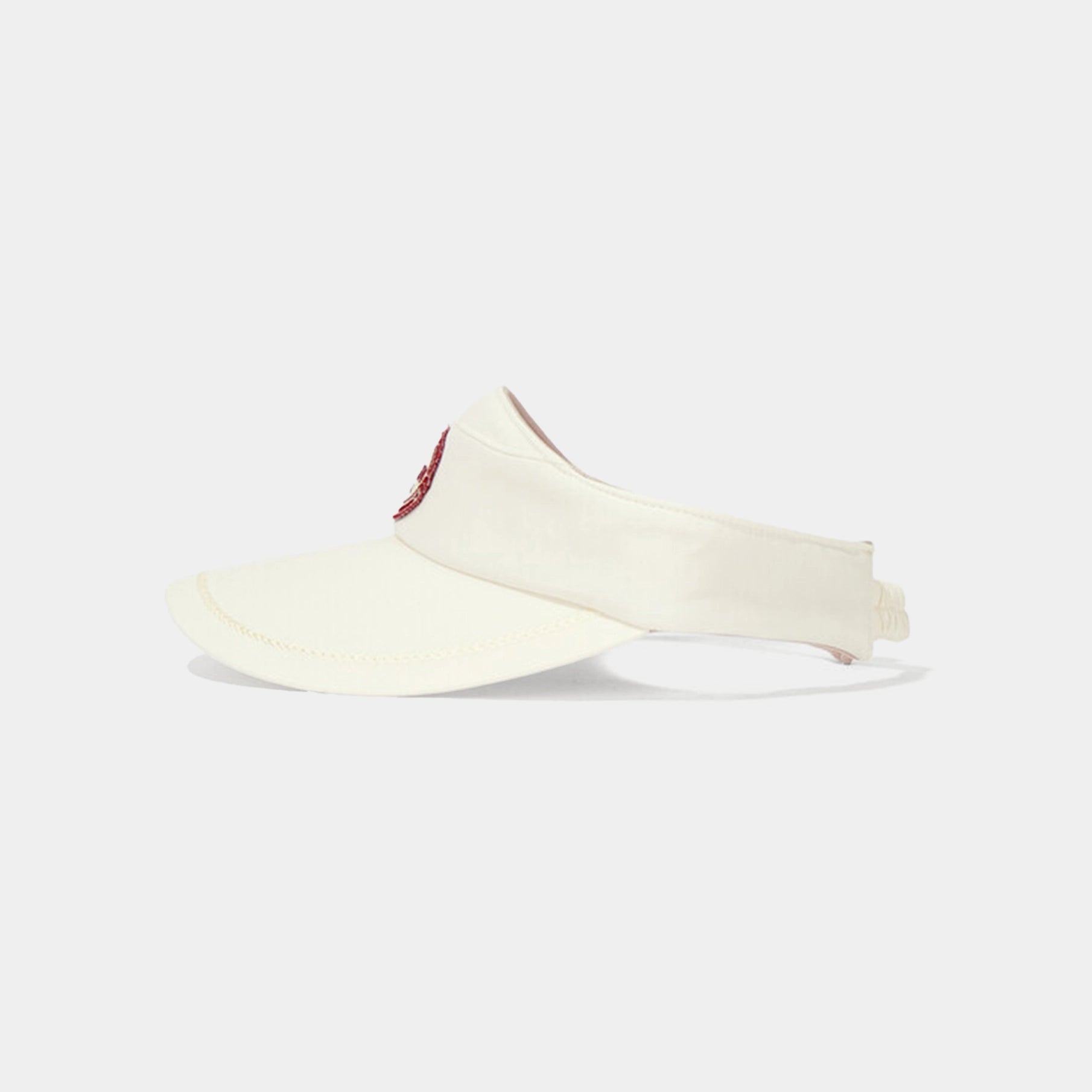 Beige visor with a red logo on a white background
