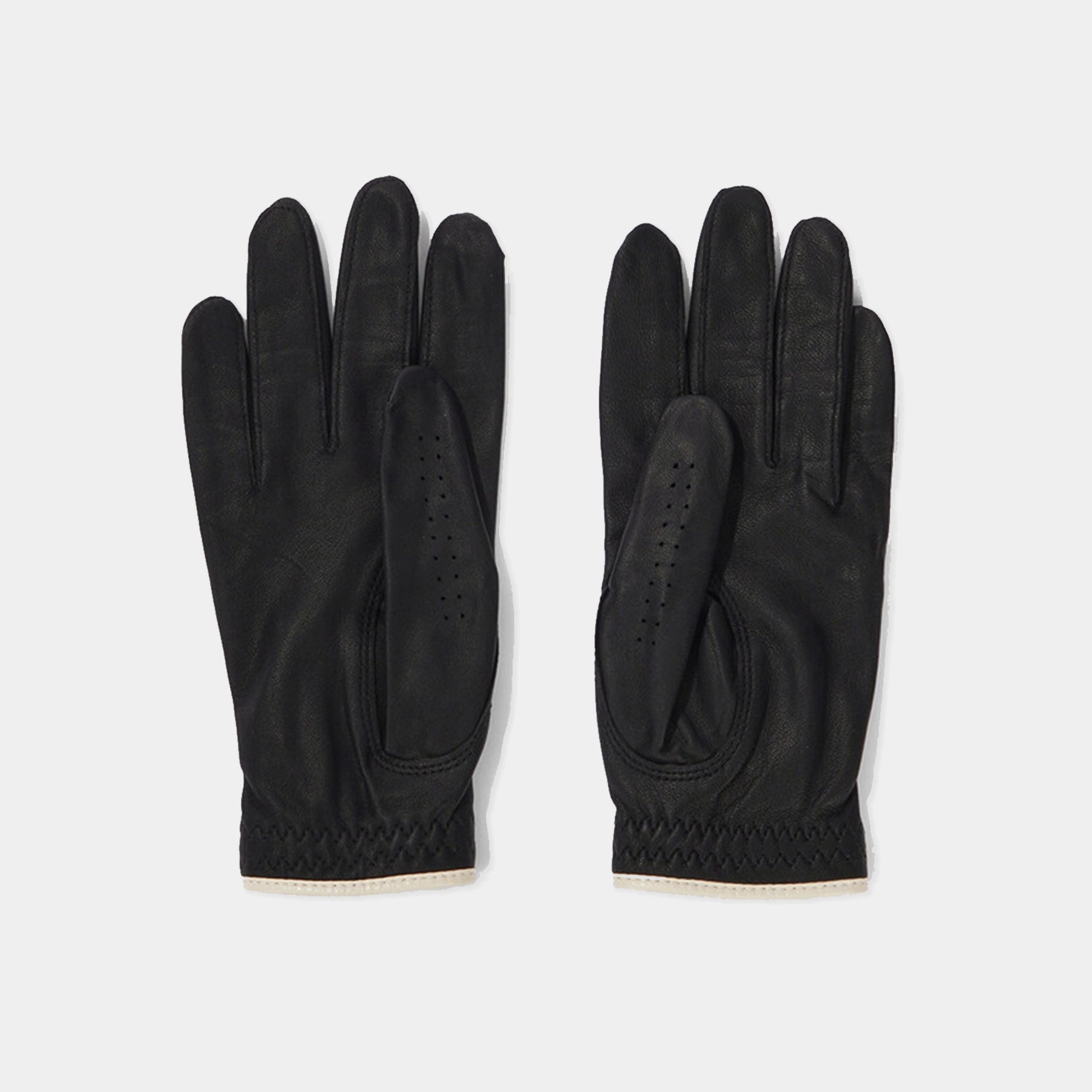 Pair of black gloves on a light gray background