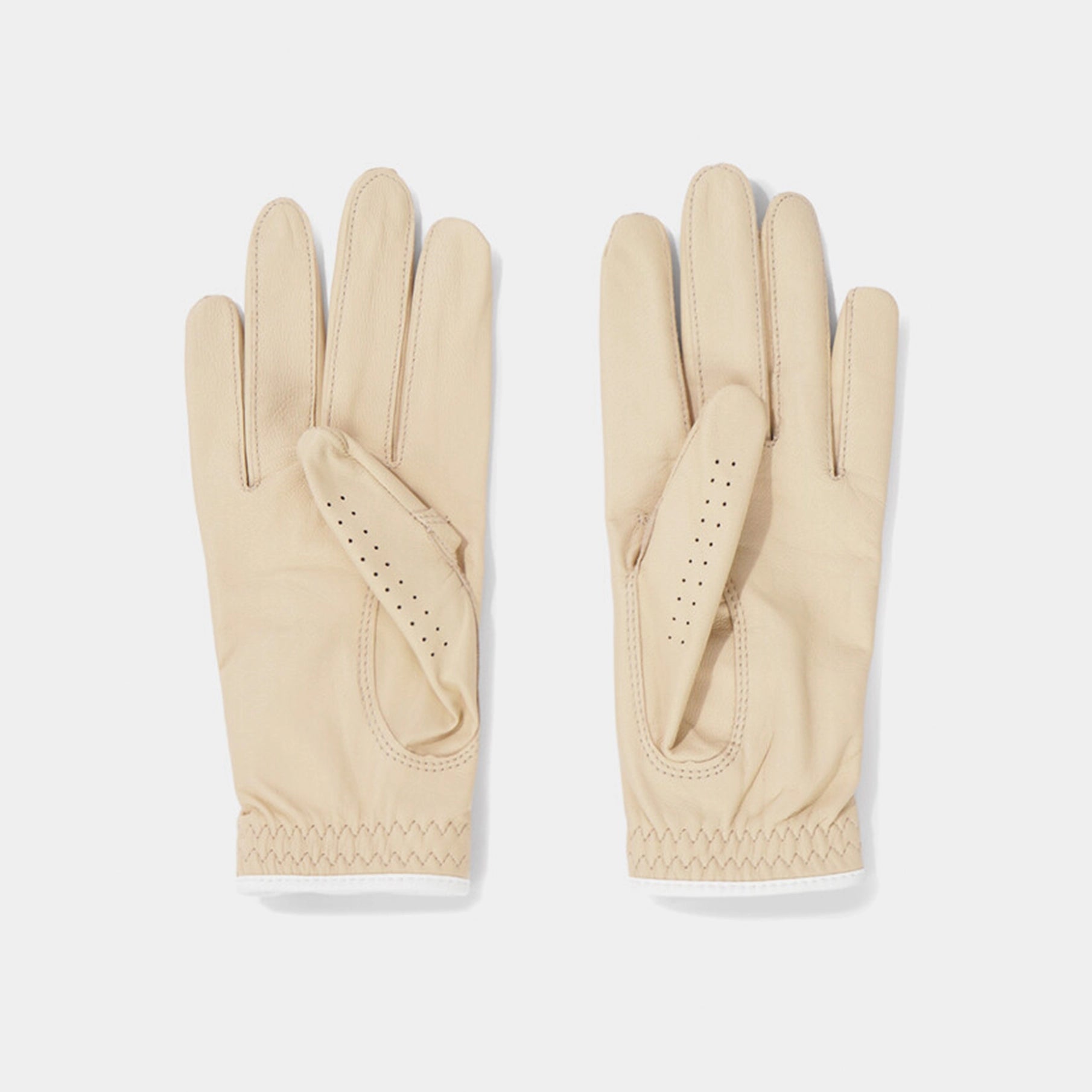 Pair of beige gloves on a light gray background
