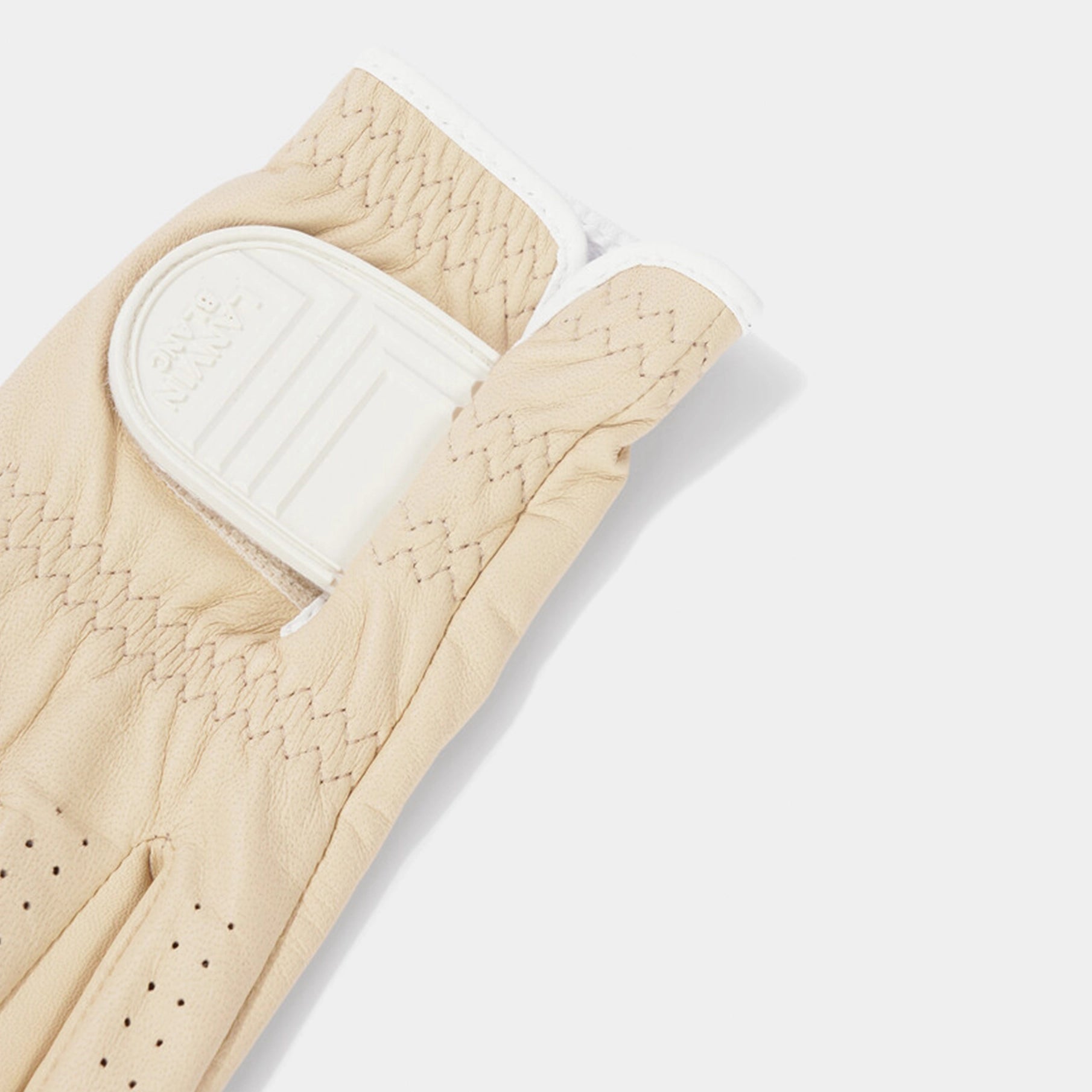 Beige glove with white interior on a light gray background