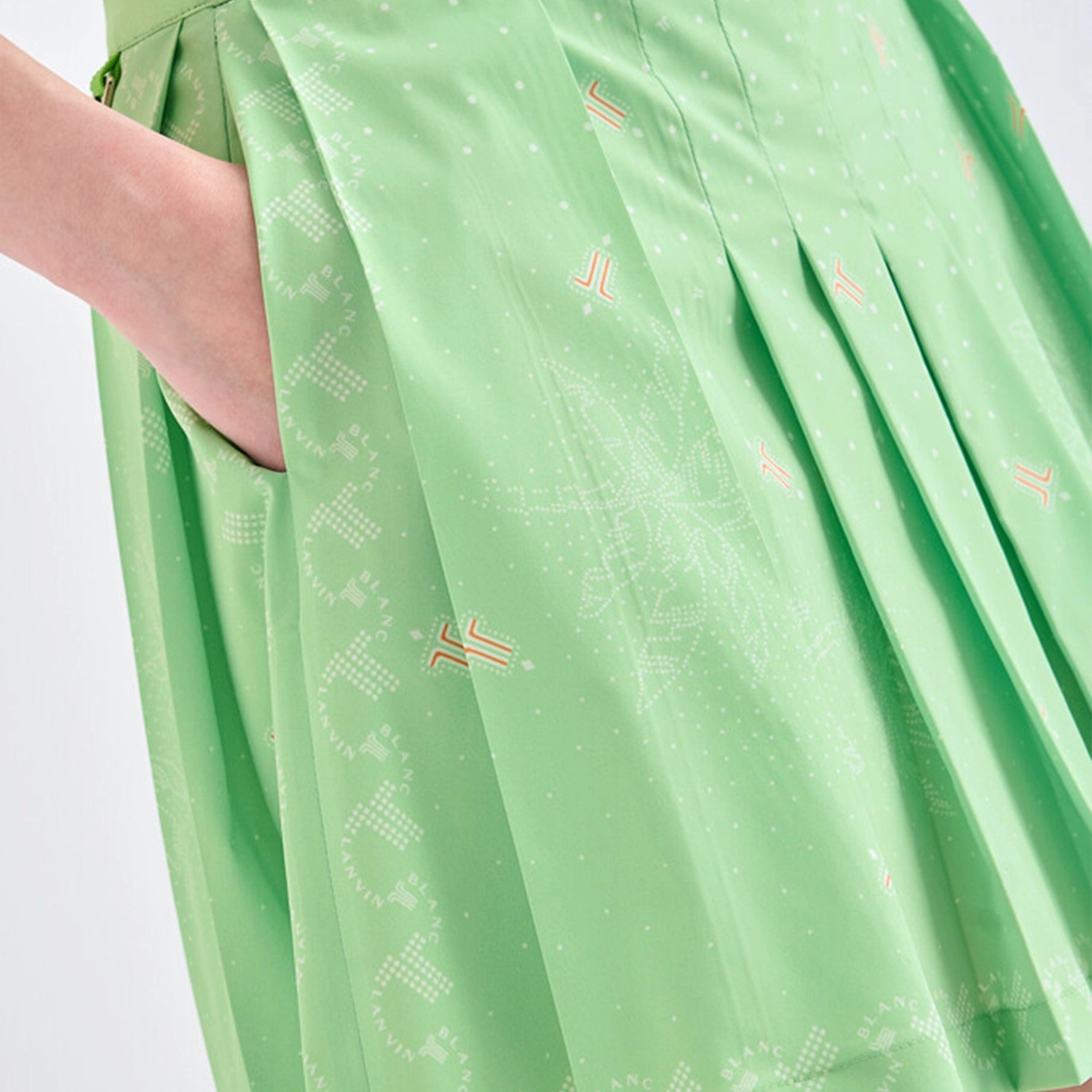 Green fabric with subtle patterns on a plain background
