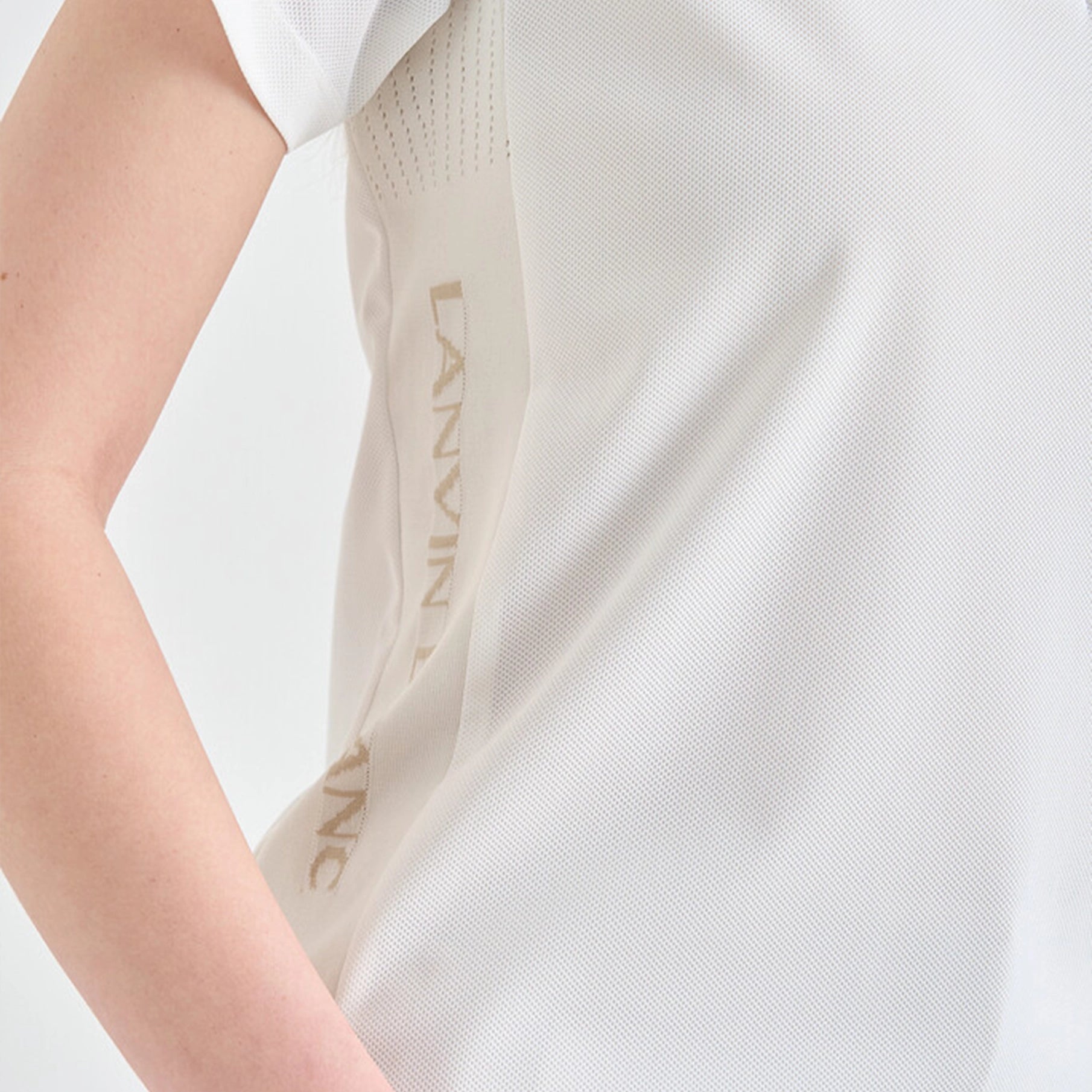 Close-up of a white garment with 'LANVIN' branding on a light background