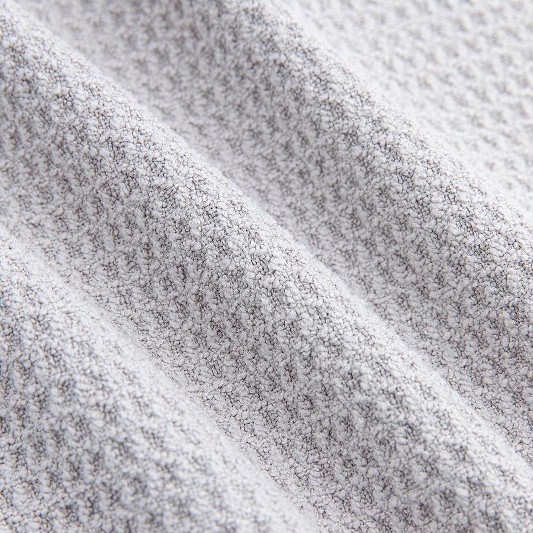 Close-up of gray magnetic golf towel premium waffle knit fabric showing soft absorbent construction - Laclavi Golf