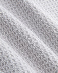 Close-up of gray magnetic golf towel premium waffle knit fabric showing soft absorbent construction - Laclavi Golf