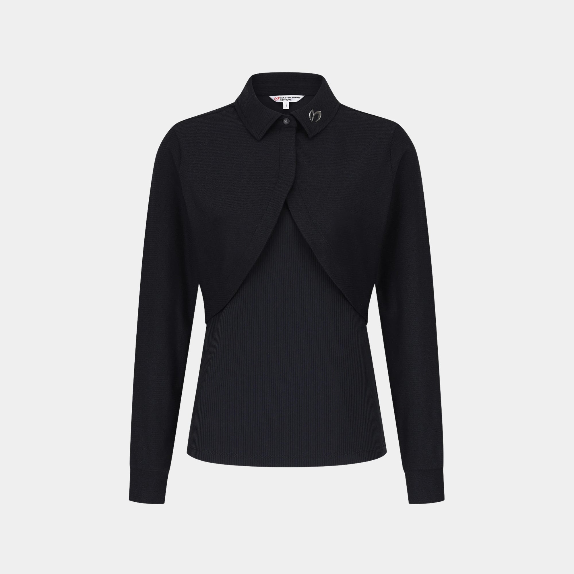 A black long-sleeve collared blouse with a draped, asymmetrical front overlay and subtle vertical ribbing, shown on a light gray background.