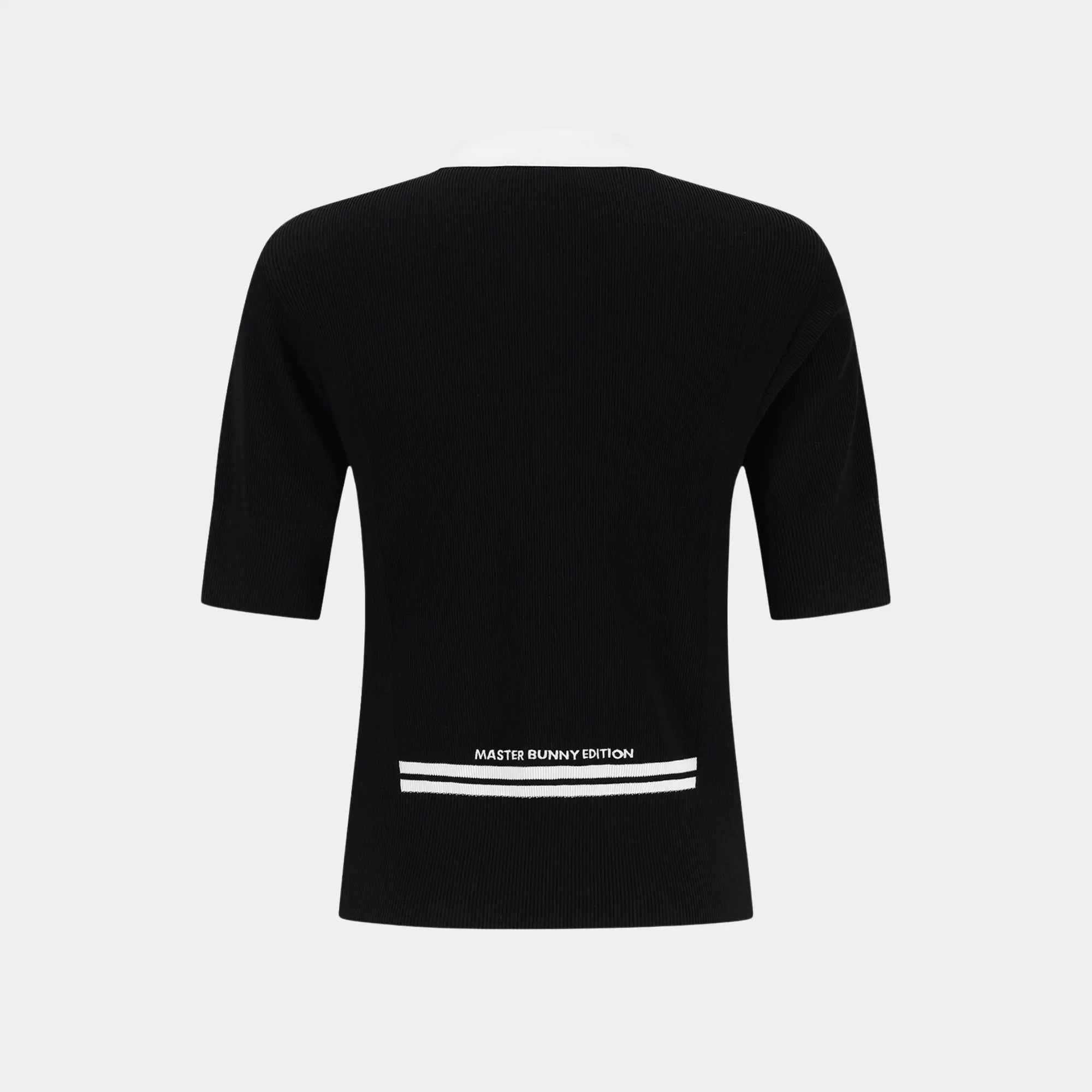 A black short-sleeve knit top shown from the back, featuring a crew neck and a white graphic print near the lower back with the text 'MASTER BUNNY EDITION' and two horizontal white stripes.