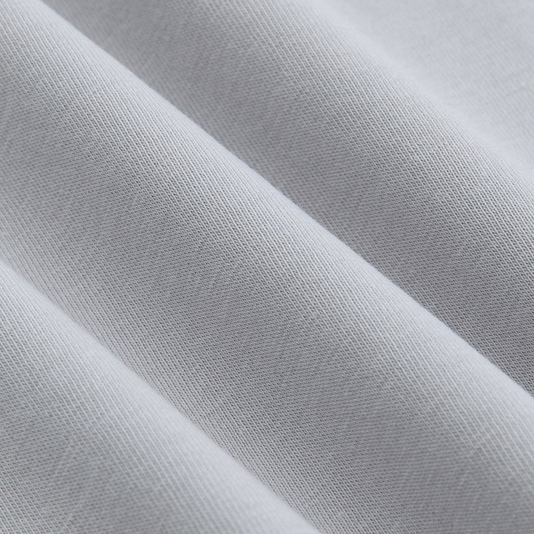 Close-up of gray golf t-shirt lightweight knit fabric texture showing premium breathable construction - Laclavi Golf