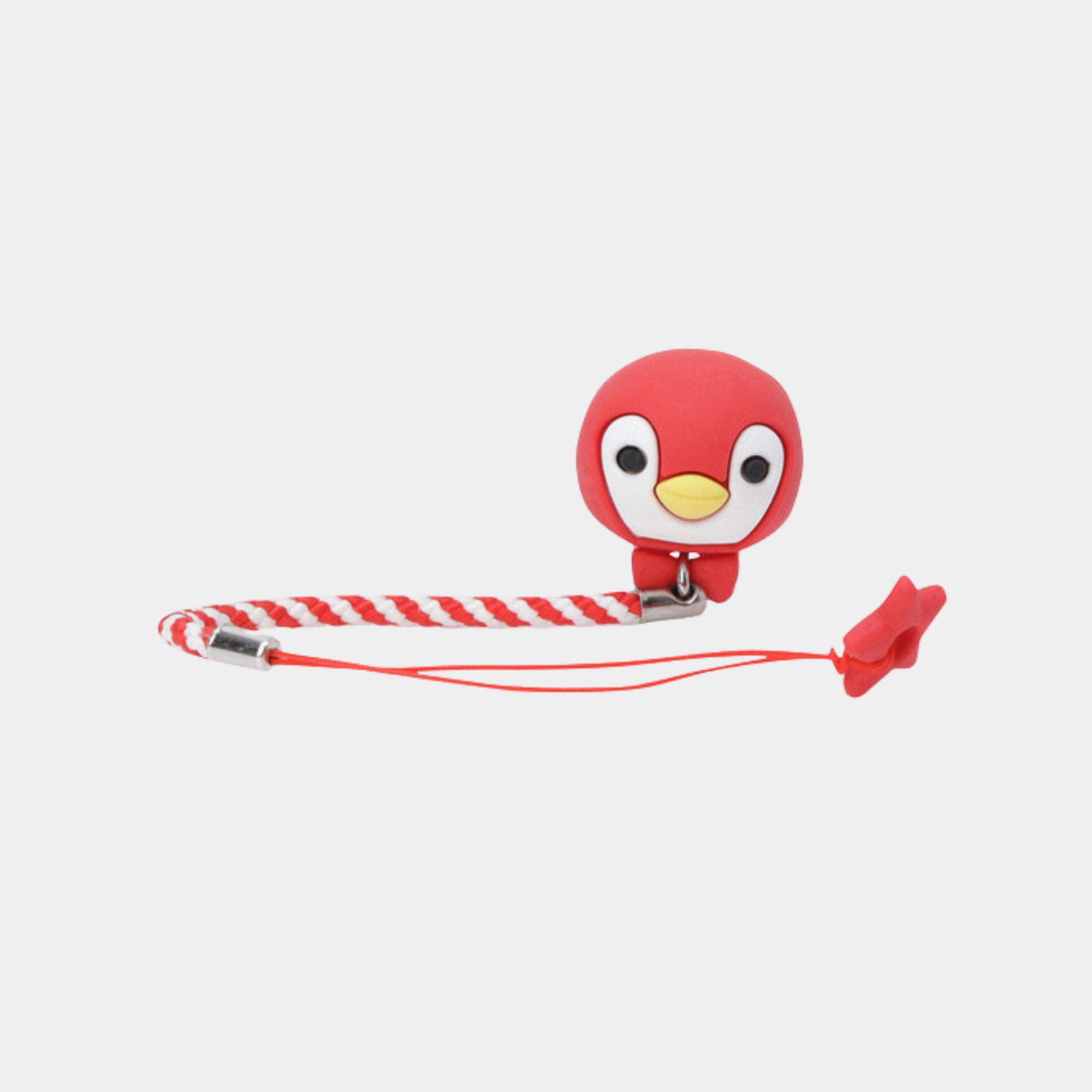 A red cartoon penguin-shaped clip or charm attached to a red-and-white striped wrist strap with silver metal clips, shown on a plain light gray background.