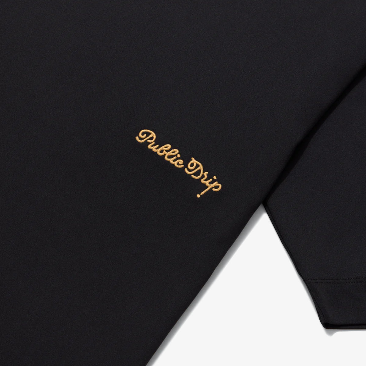 Close-up of the golf shirt showing its breathable textured fabric.
