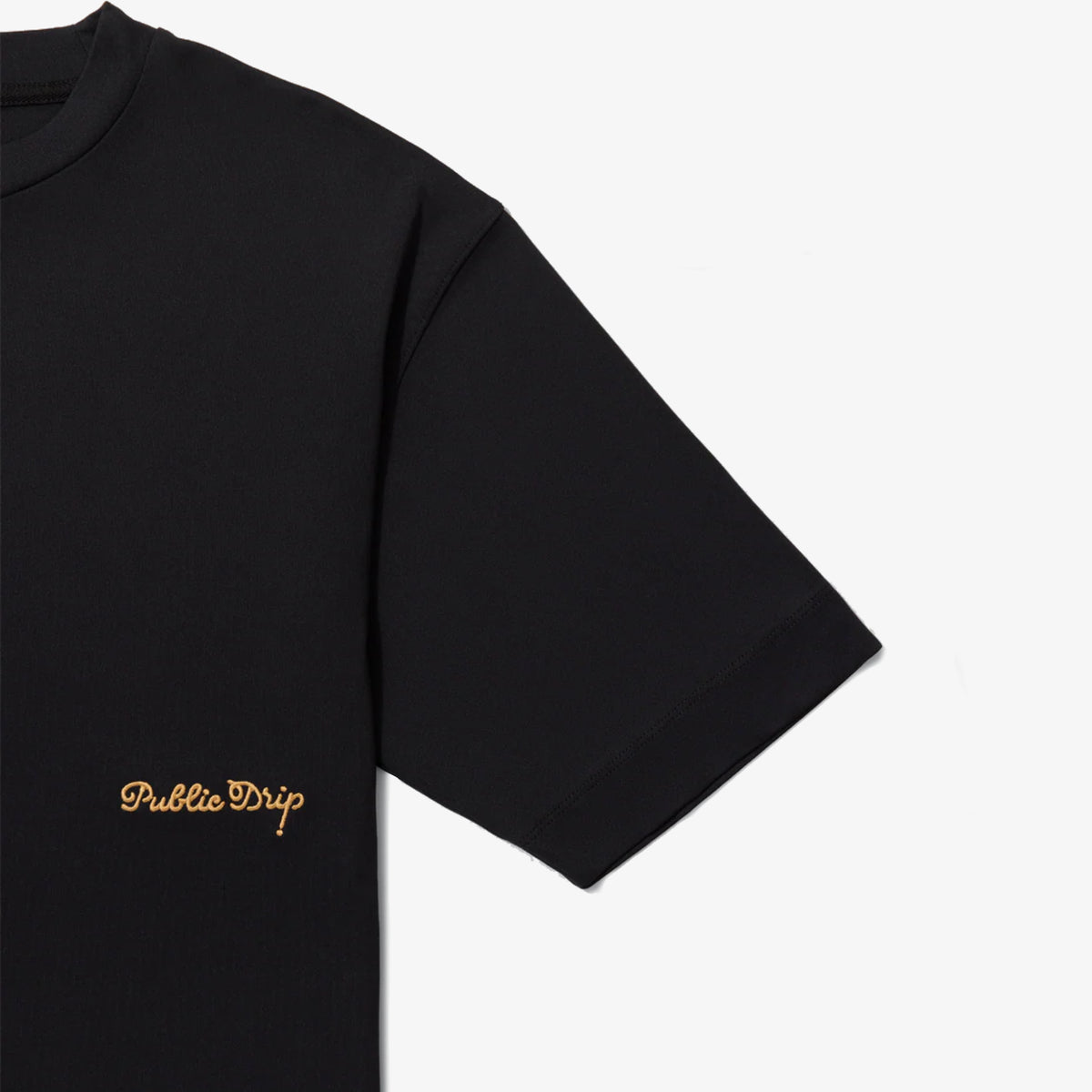 Close-up of the golf shirt showing its breathable textured fabric.