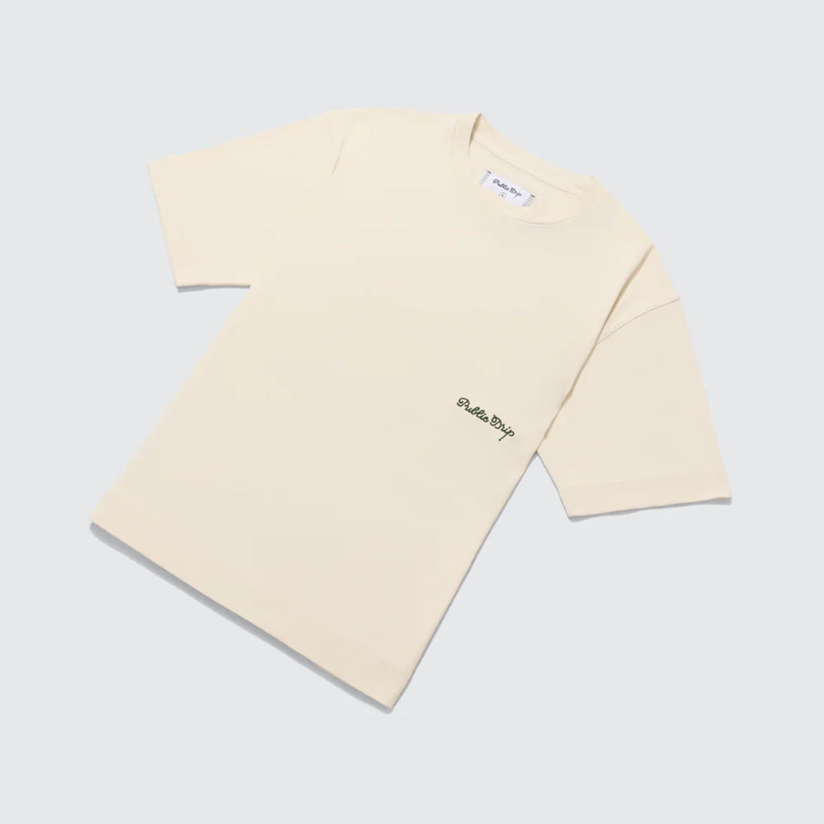 Flat lay of a cream t-shirt.
