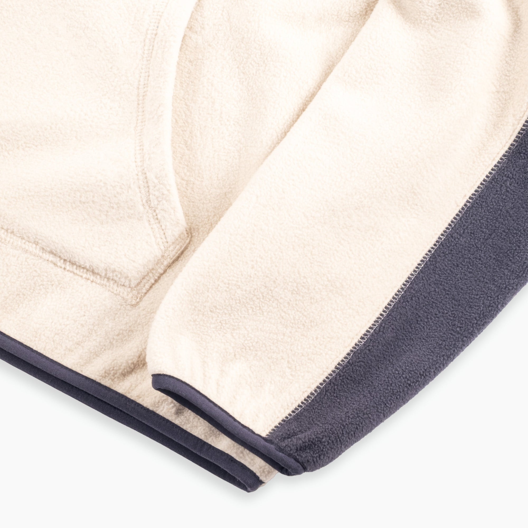 Close-up of a men’s fleece hoodie in beige with navy contrast panel, showing sleeve, cuff, and hem detail.  Men's Hoodie - Beige - Erthe Golf