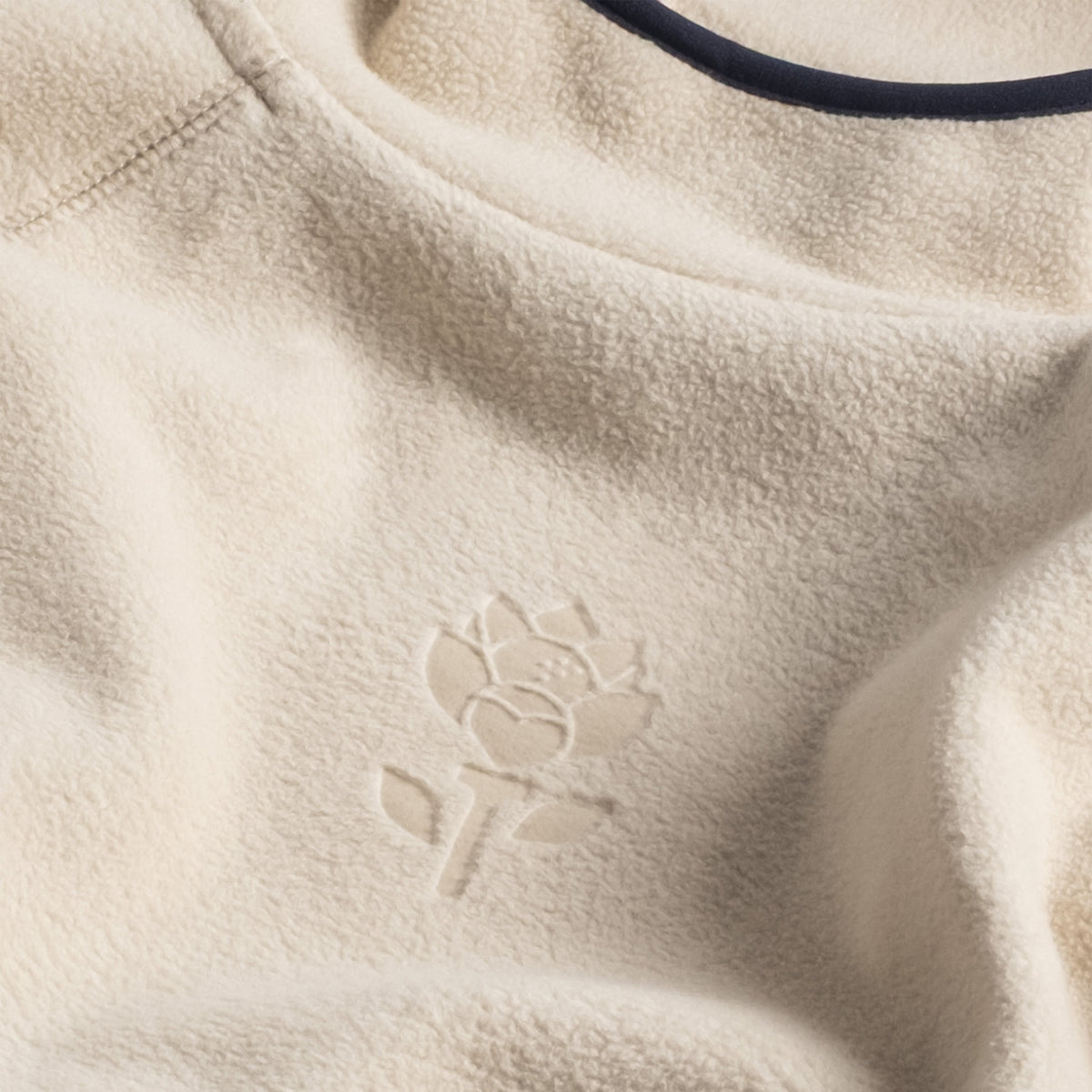 Detailed view of the fabric and the embossed flower in Men's Hoodie - Beige - Erthe Golf