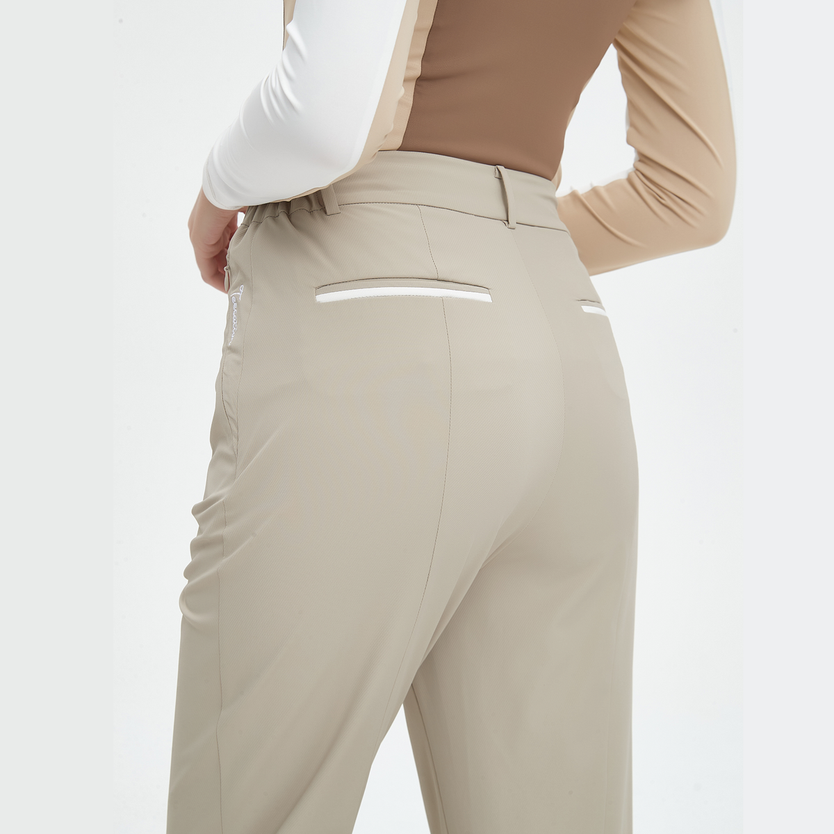 Beige pants with reflective stripes on a white background